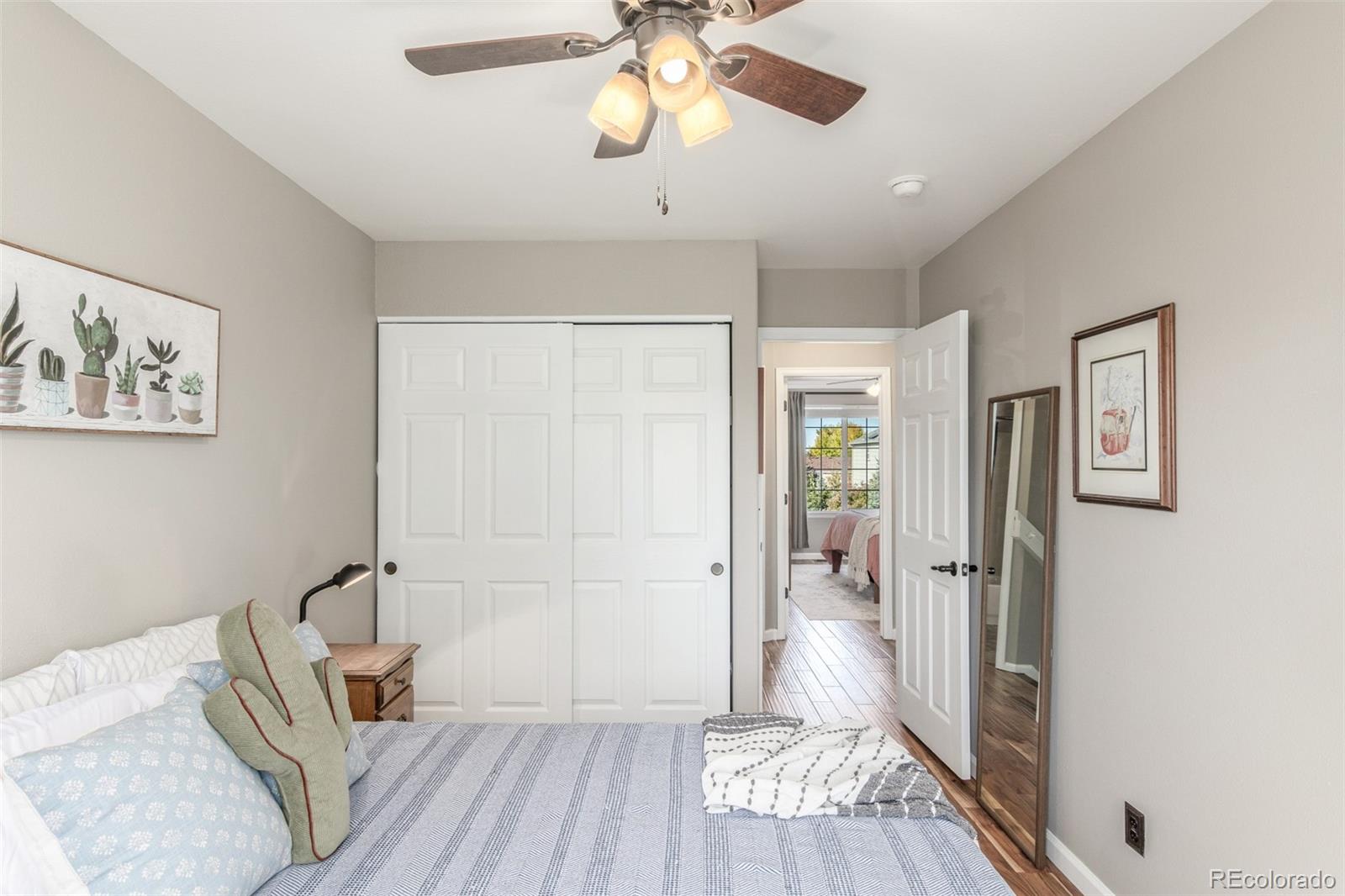 4864 Parsons Way Castle Rock, CO 80104 - Photo 19 of 50 a bedroom with furniture and a window