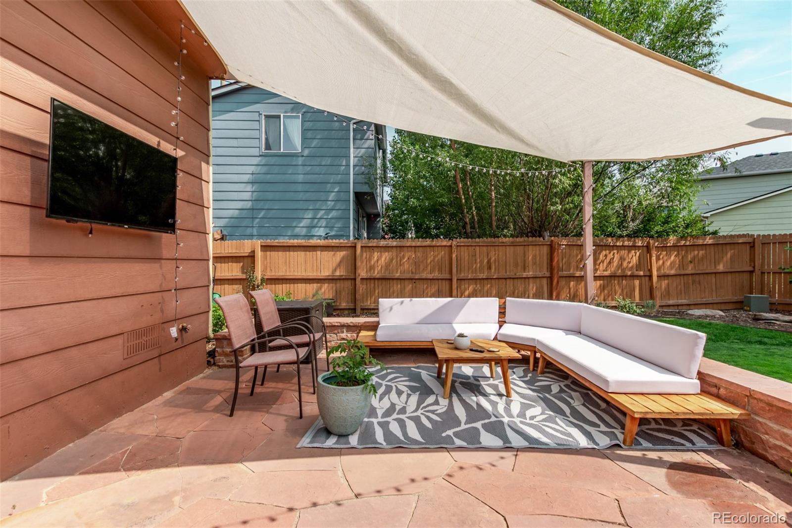 4864 Parsons Way Castle Rock, CO 80104 - Photo 28 of 50 a outdoor space with patio the couches and a dining table with garden view