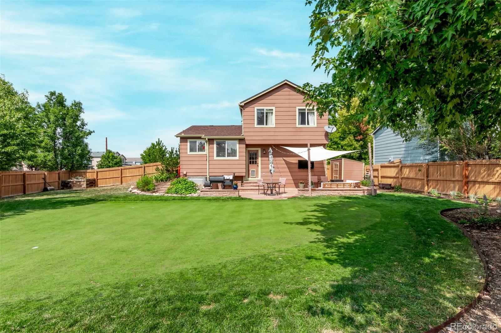 4864 Parsons Way Castle Rock, CO 80104 - Photo 31 of 50 a front view of a house with a yard