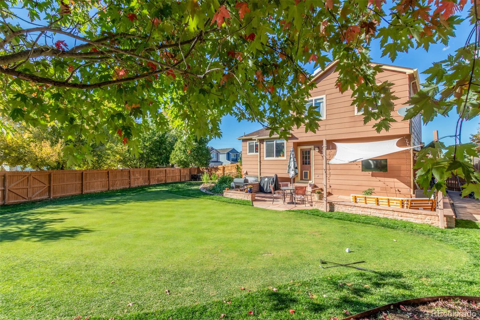 4864 Parsons Way Castle Rock, CO 80104 - Photo 37 of 50 a view of a house with a yard and sitting area