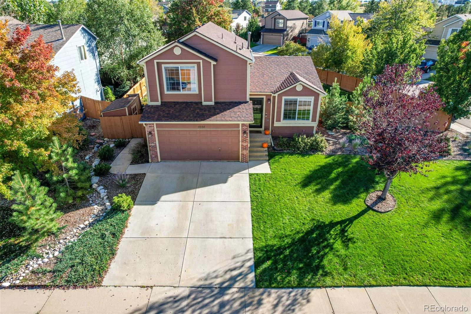 4864 Parsons Way Castle Rock, CO 80104 - Photo 42 of 50 a aerial view of a house with yard and green space