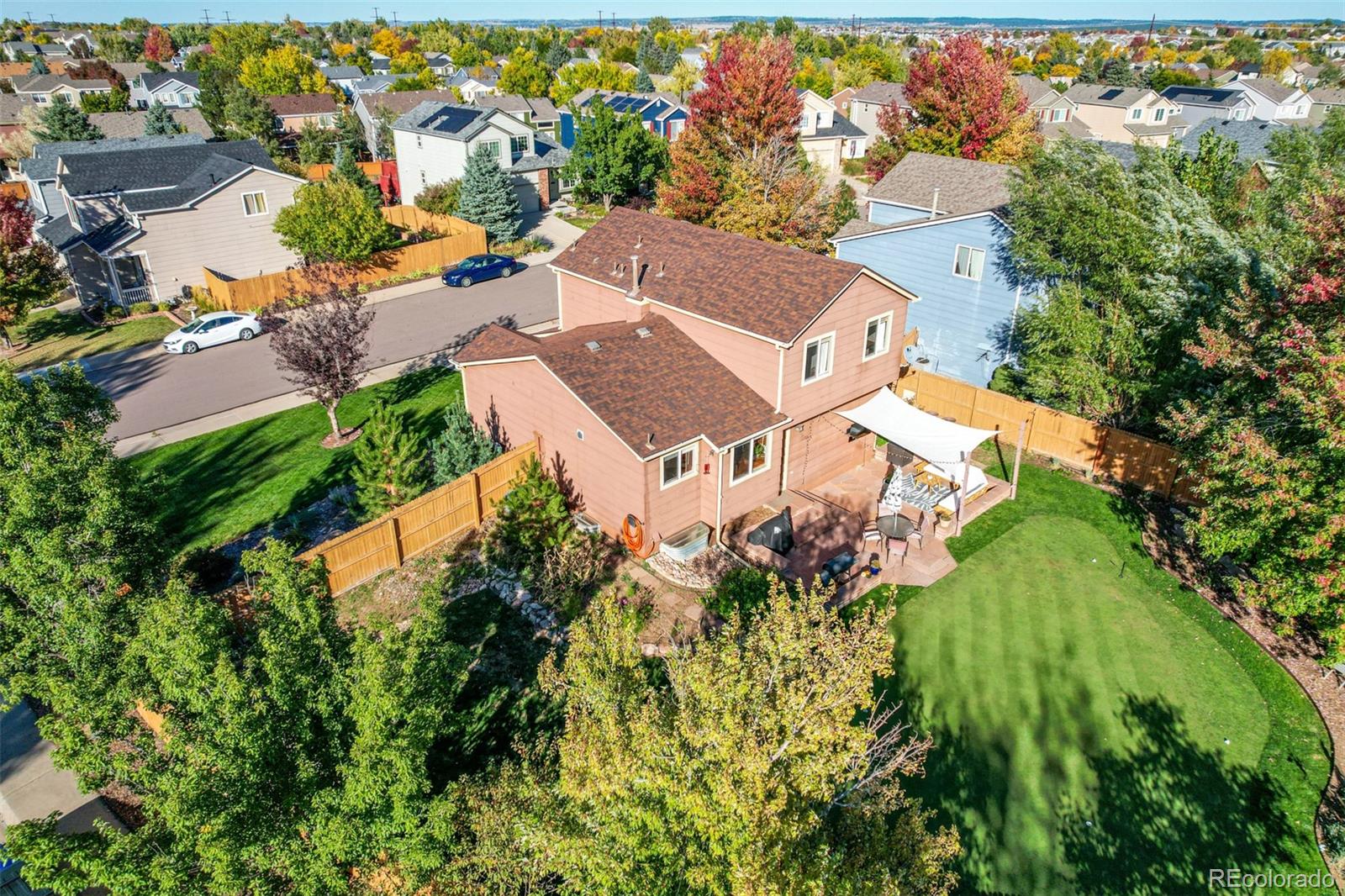 4864 Parsons Way Castle Rock, CO 80104 - Photo 48 of 50 an aerial view of a house with a yard