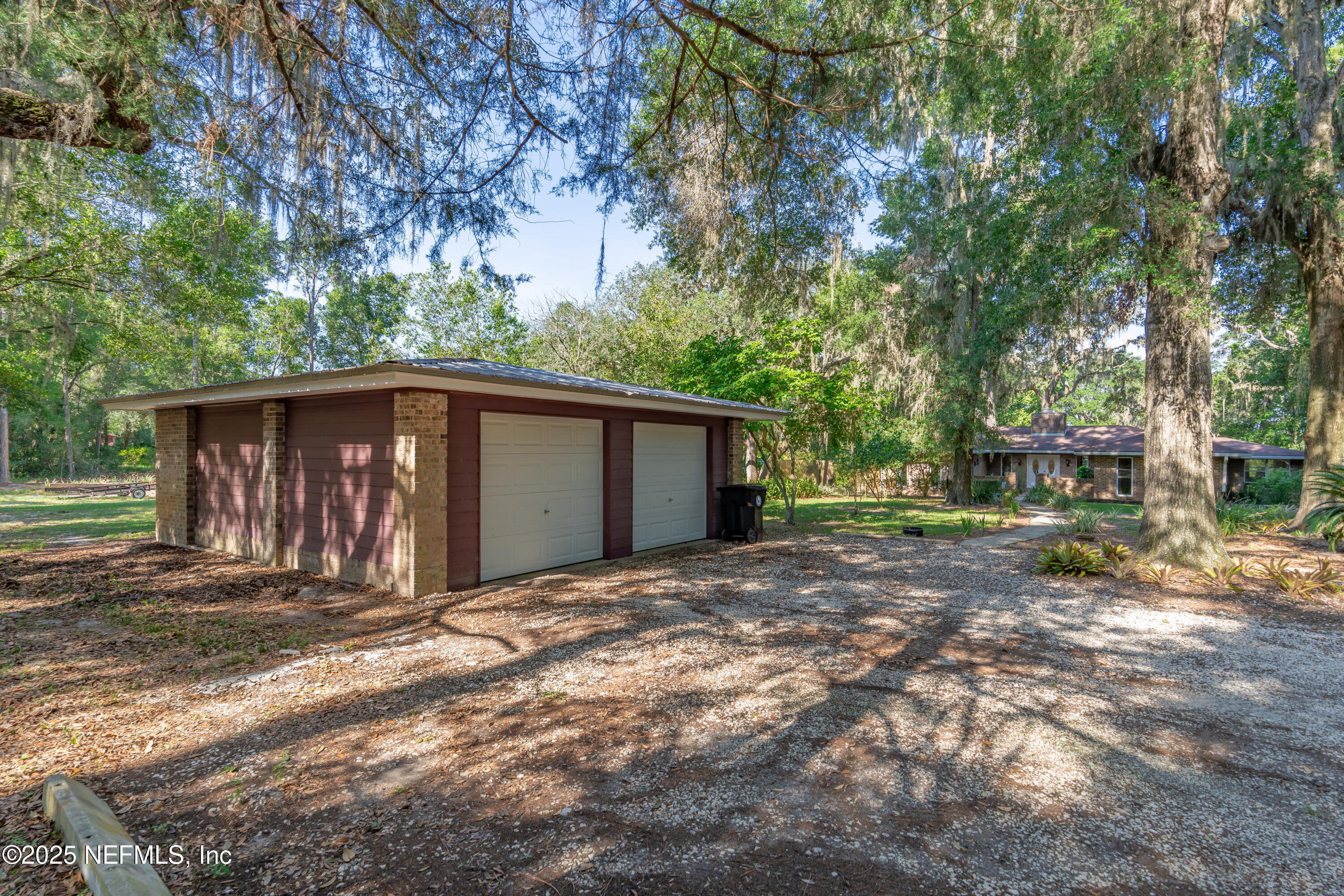 8048 County Line Road Melrose, FL 32666 - Photo 14 of 40 a view of a house with a yard
