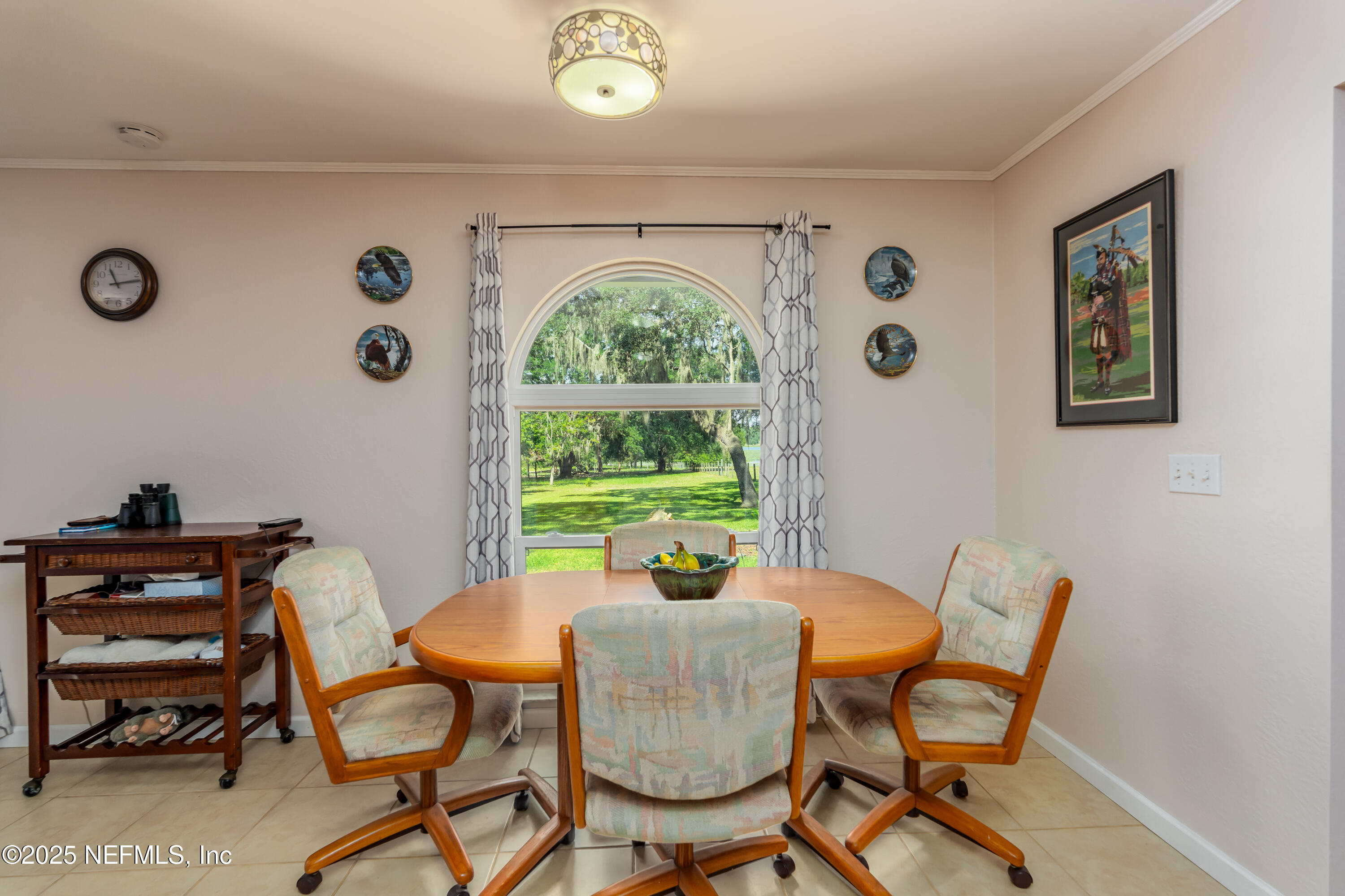 8048 County Line Road Melrose, FL 32666 - Photo 28 of 40 a view of a dining room with furniture window and outside view