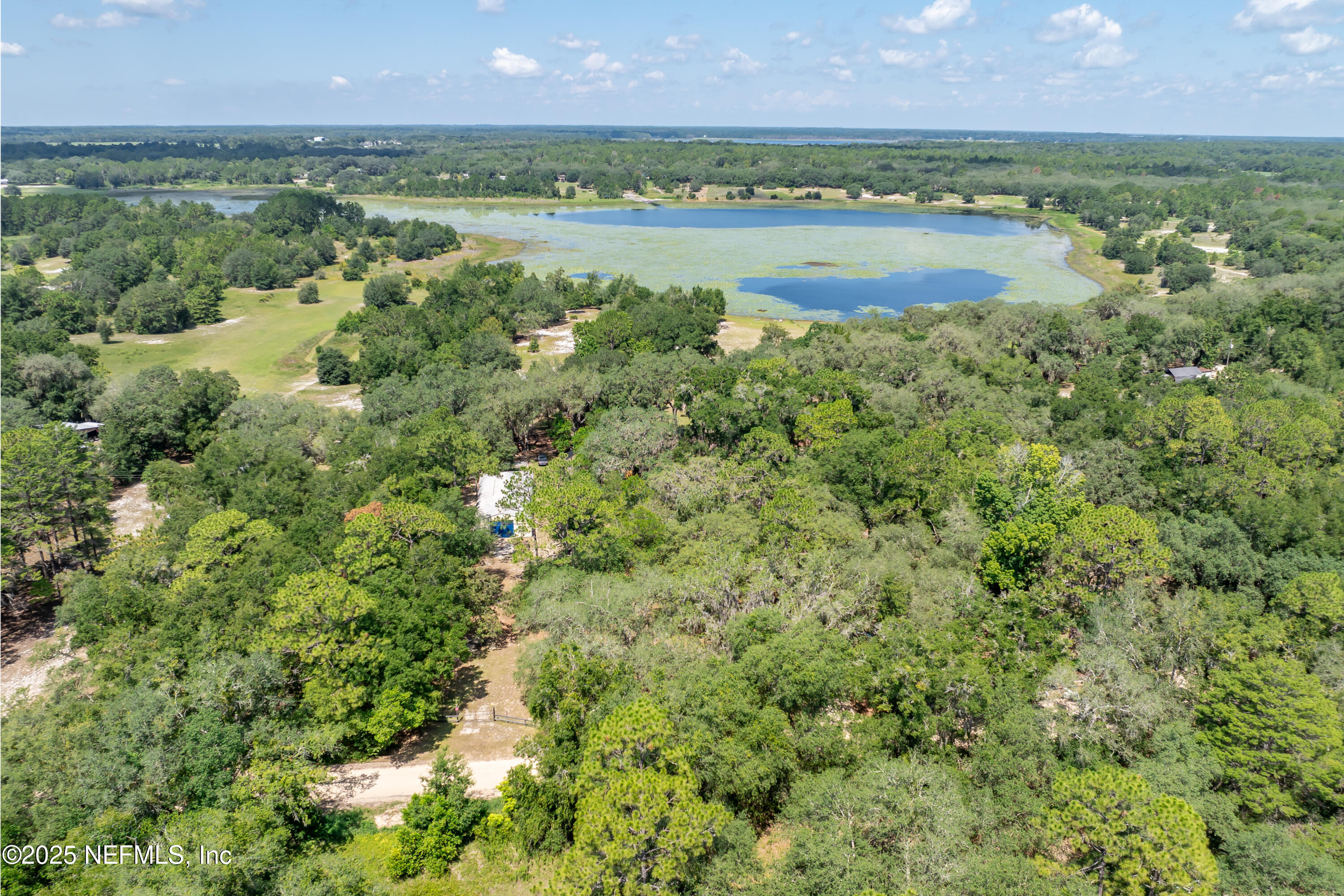 8048 County Line Road Melrose, FL 32666 - Photo 35 of 40 a view of a lake with a city