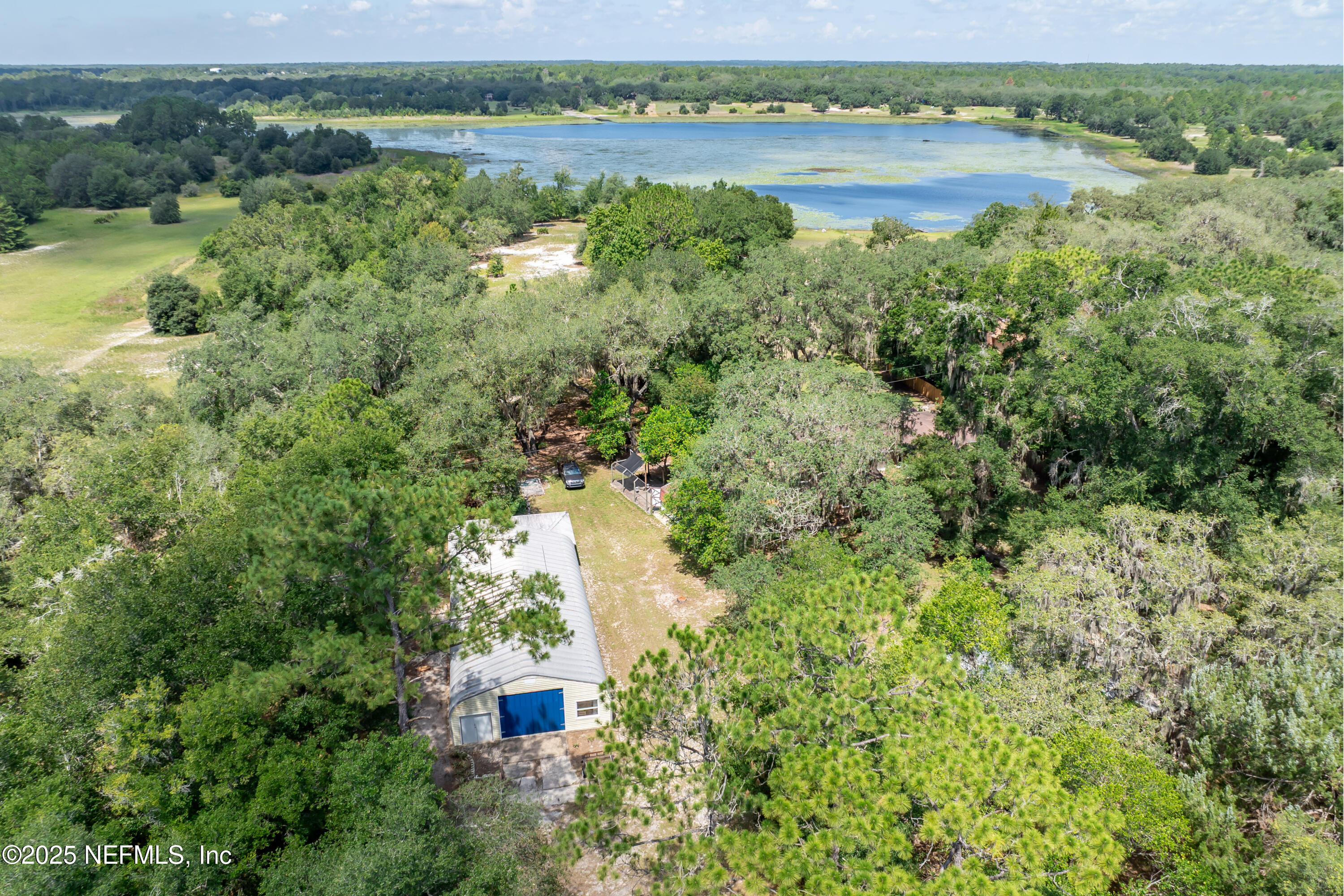 8048 County Line Road Melrose, FL 32666 - Photo 38 of 40 an aerial view of a houses with outdoor space and lake view