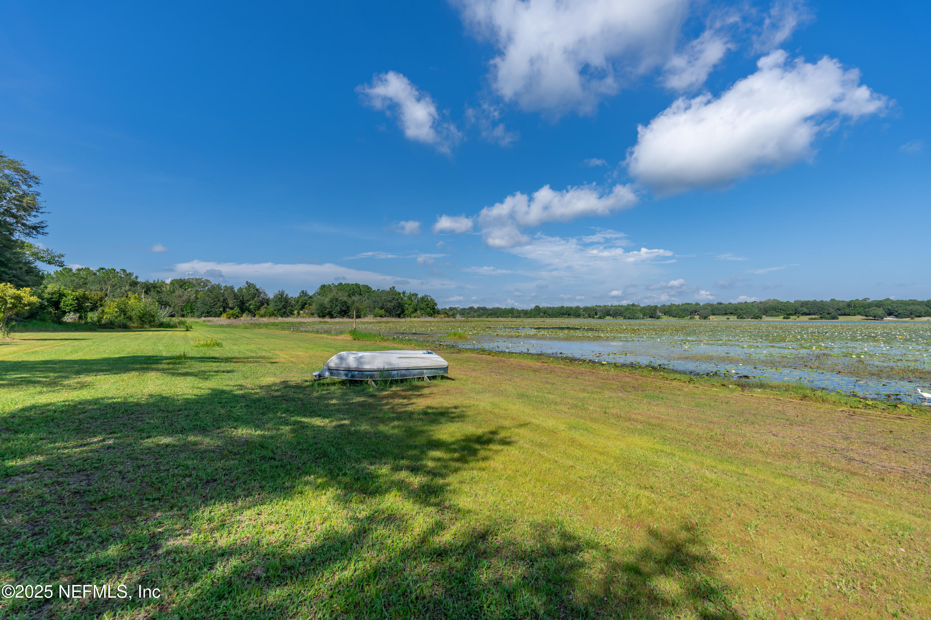 8048 County Line Road Melrose, FL 32666 - Photo 10 of 40 a view of a lake with a big yard