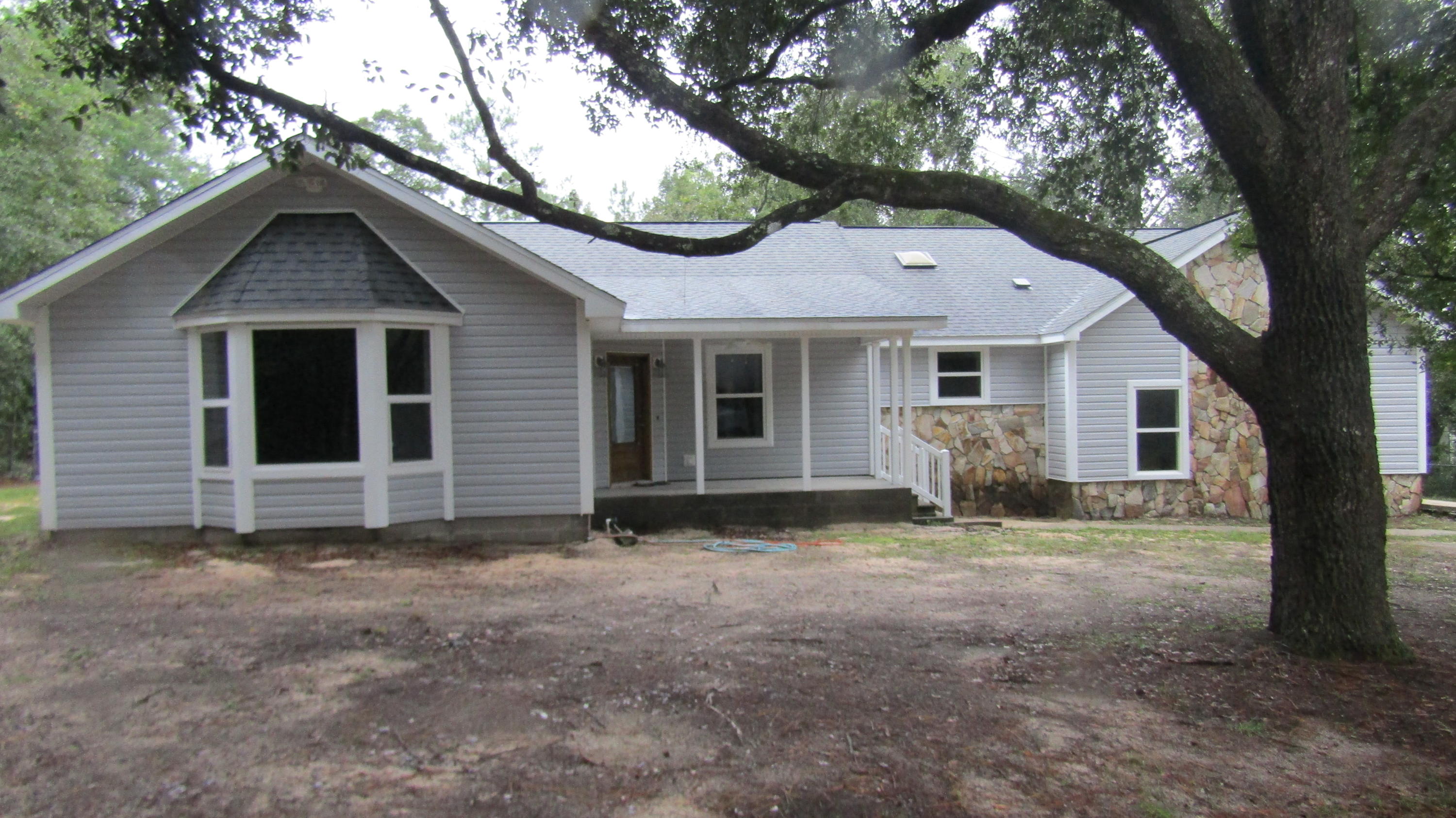 6130 Beasley Road Crestview, FL 32536 - Photo 1 of 28 a view of a house with a yard