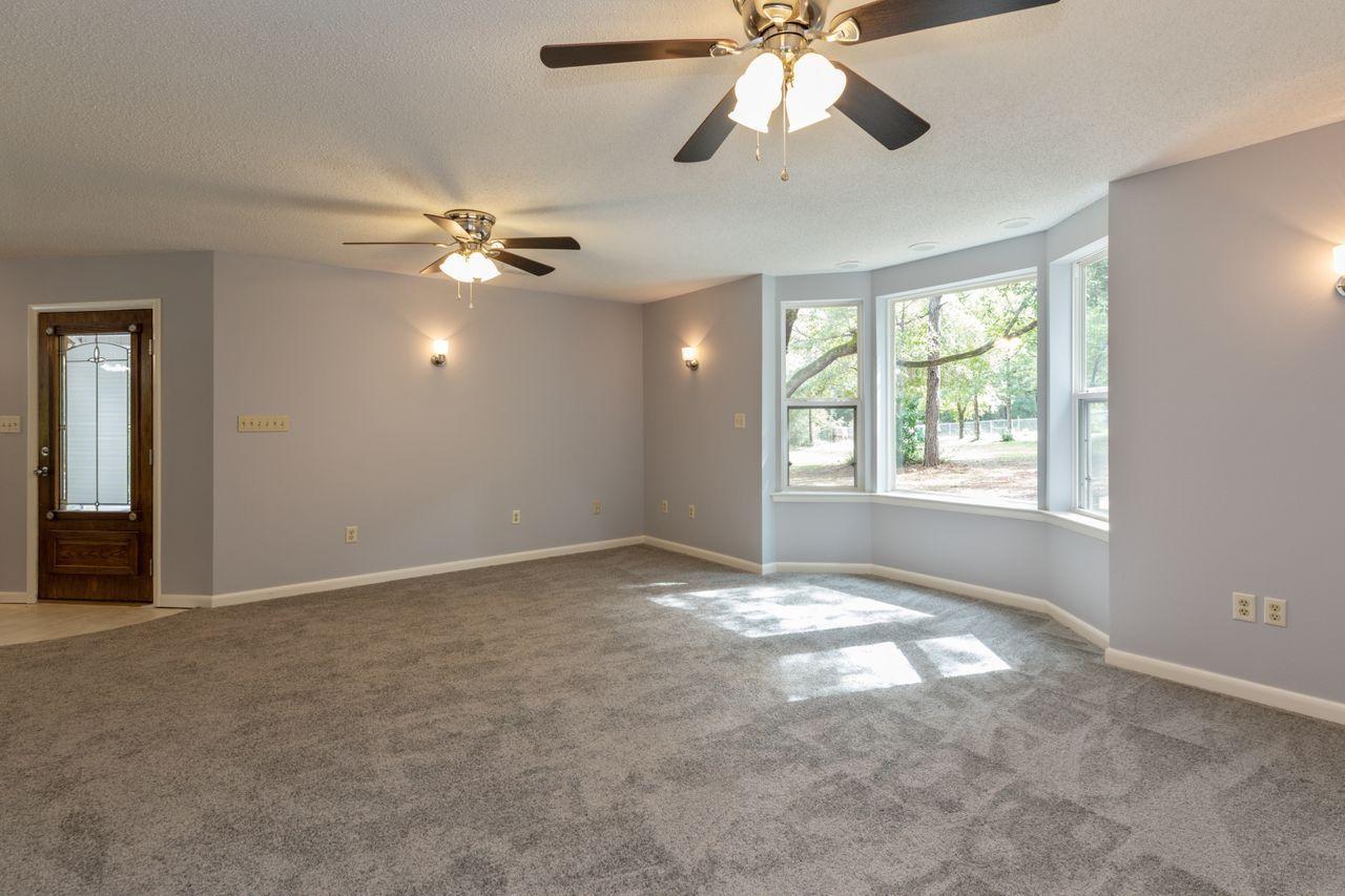 6130 Beasley Road Crestview, FL 32536 - Photo 2 of 28 an empty room with windows and fan