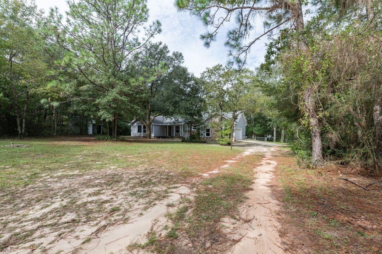 6130 Beasley Road Crestview, FL 32536 - Photo 27 of 28 a view of a yard with tree s