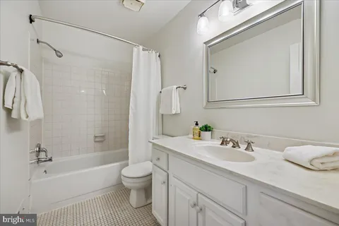 a bathroom with a sink a toilet and a bathtub