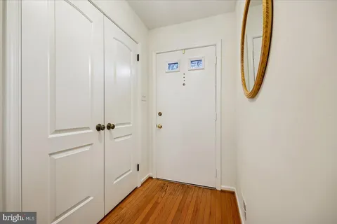 a view of a room with wooden floor