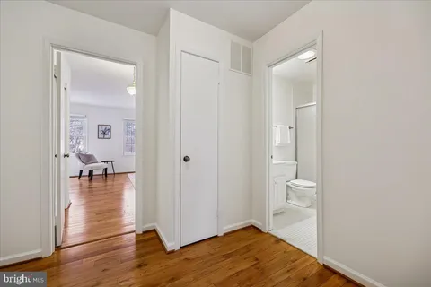 a view of a bathroom from a hallway