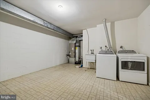 a view of a storage & utility room with washer and dryer
