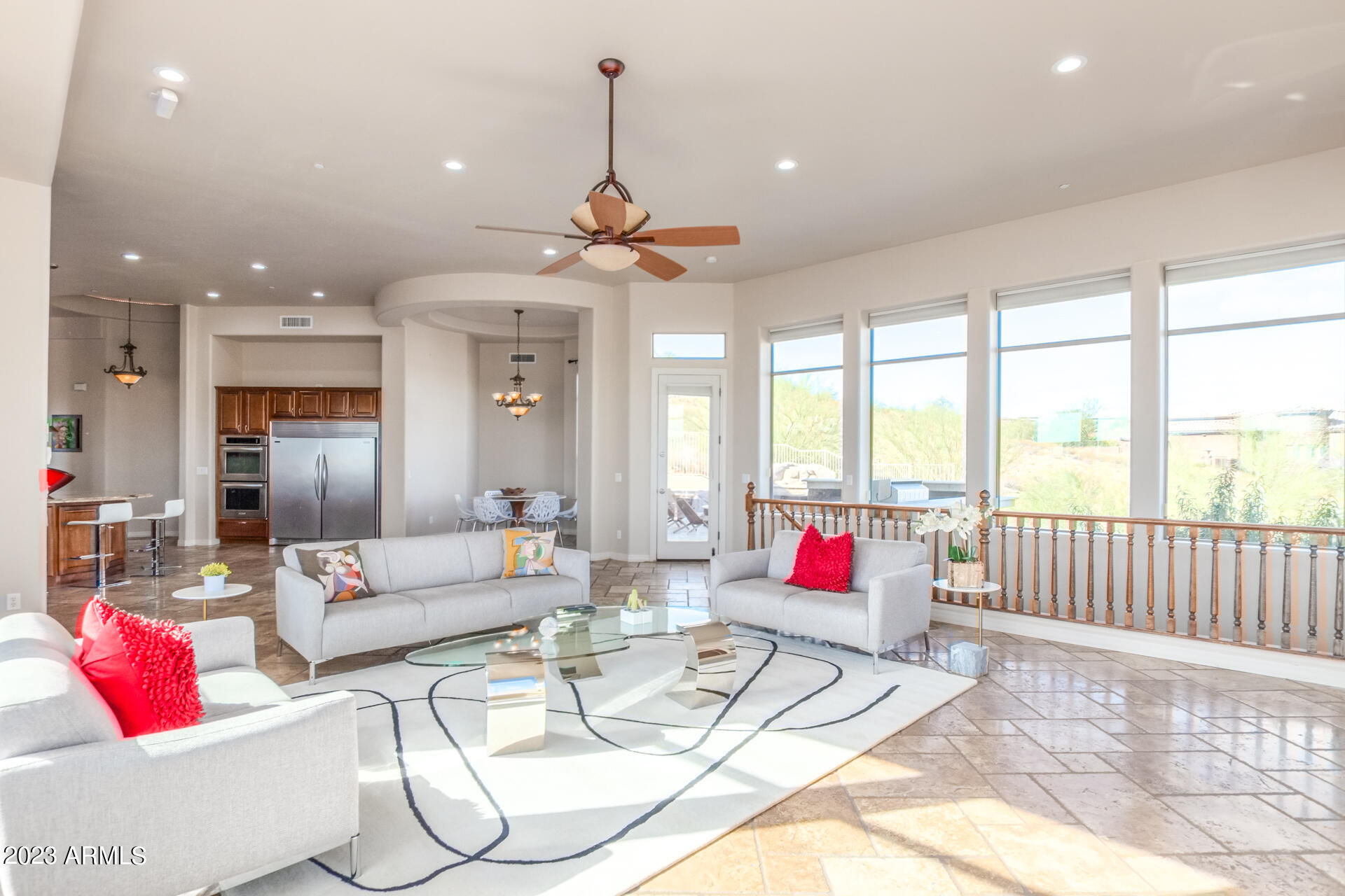 14234 North 27th Place Phoenix, AZ 85032 - Photo 11 of 66 a living room with kitchen island furniture and a chandelier