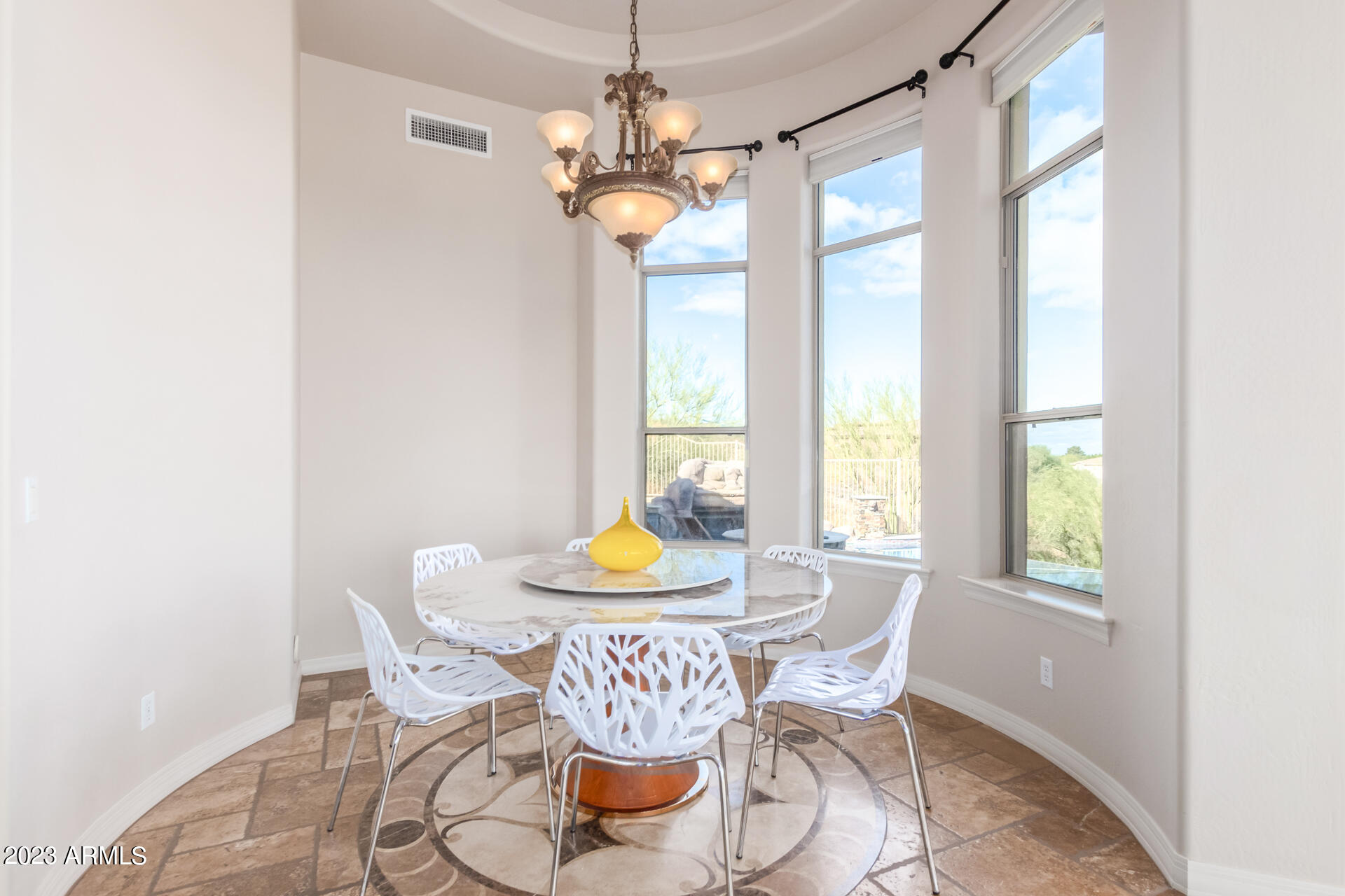 14234 North 27th Place Phoenix, AZ 85032 - Photo 13 of 66 a dining room with furniture and window