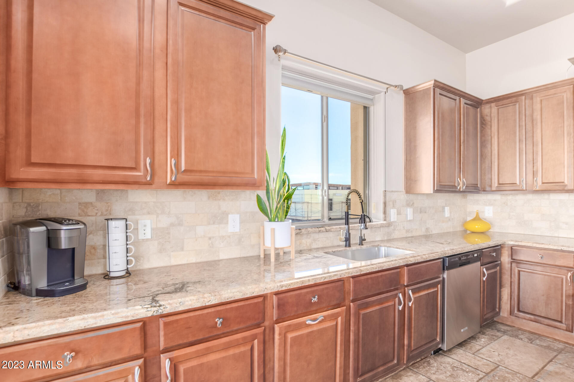 14234 North 27th Place Phoenix, AZ 85032 - Photo 17 of 66 a kitchen with granite countertop a sink stainless steel appliances and cabinets
