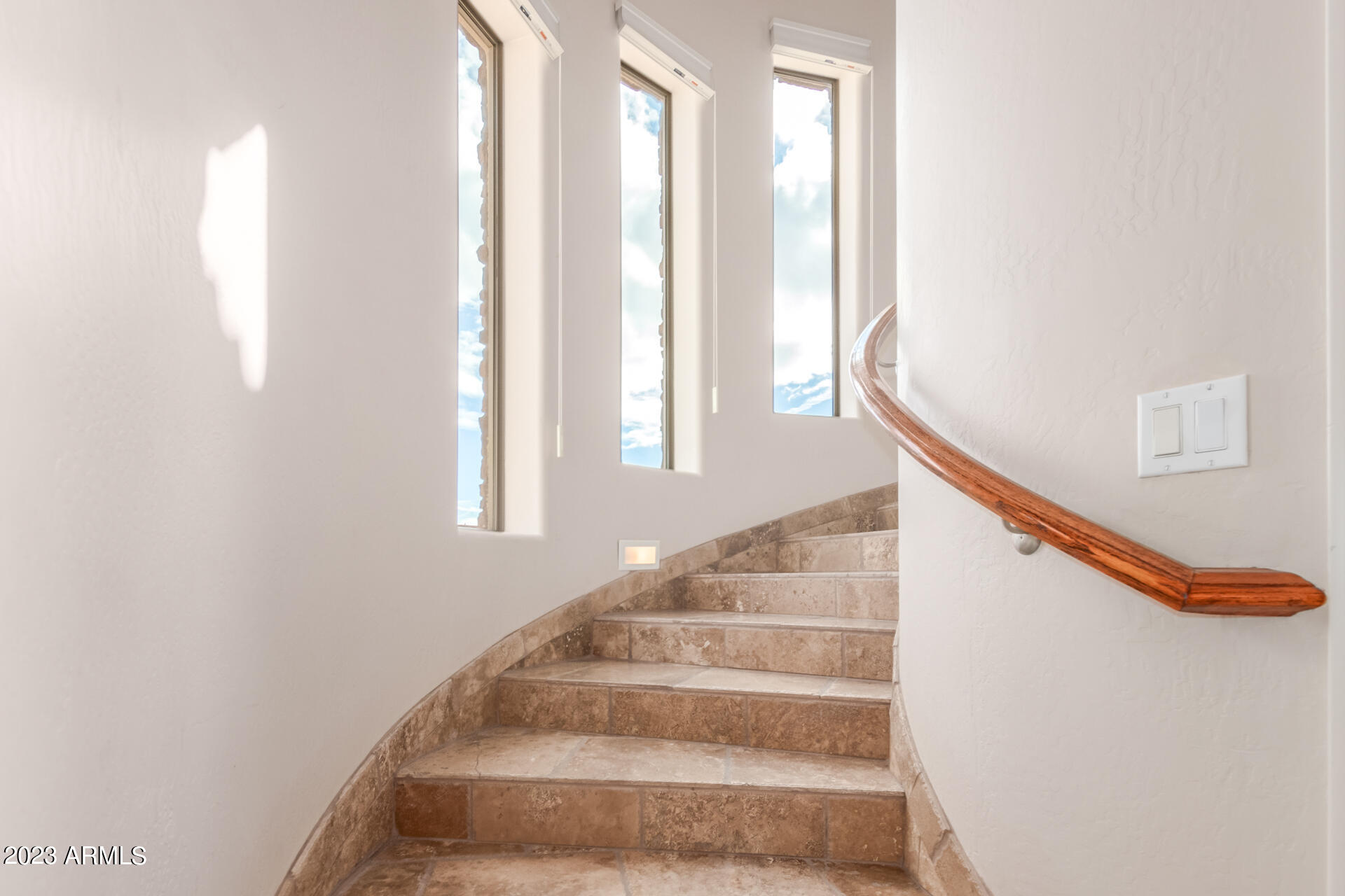 14234 North 27th Place Phoenix, AZ 85032 - Photo 18 of 66 a view of staircase with white walls and a window