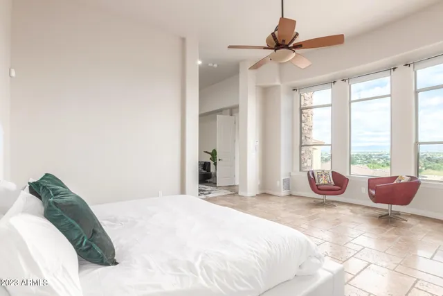 a bath tub sitting in a bathroom next to a window