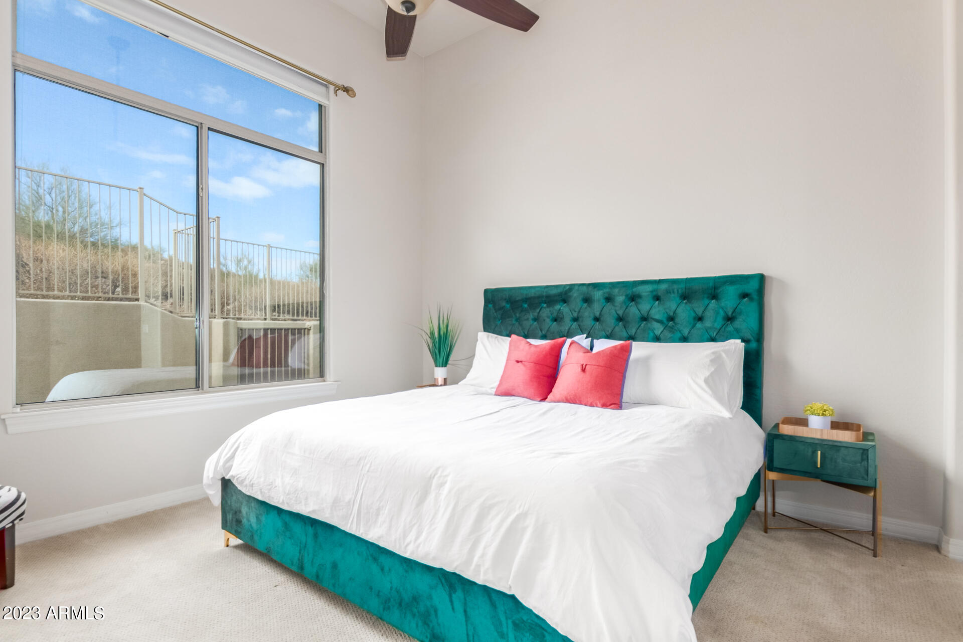 14234 North 27th Place Phoenix, AZ 85032 - Photo 28 of 66 a bedroom with a bed and a large window