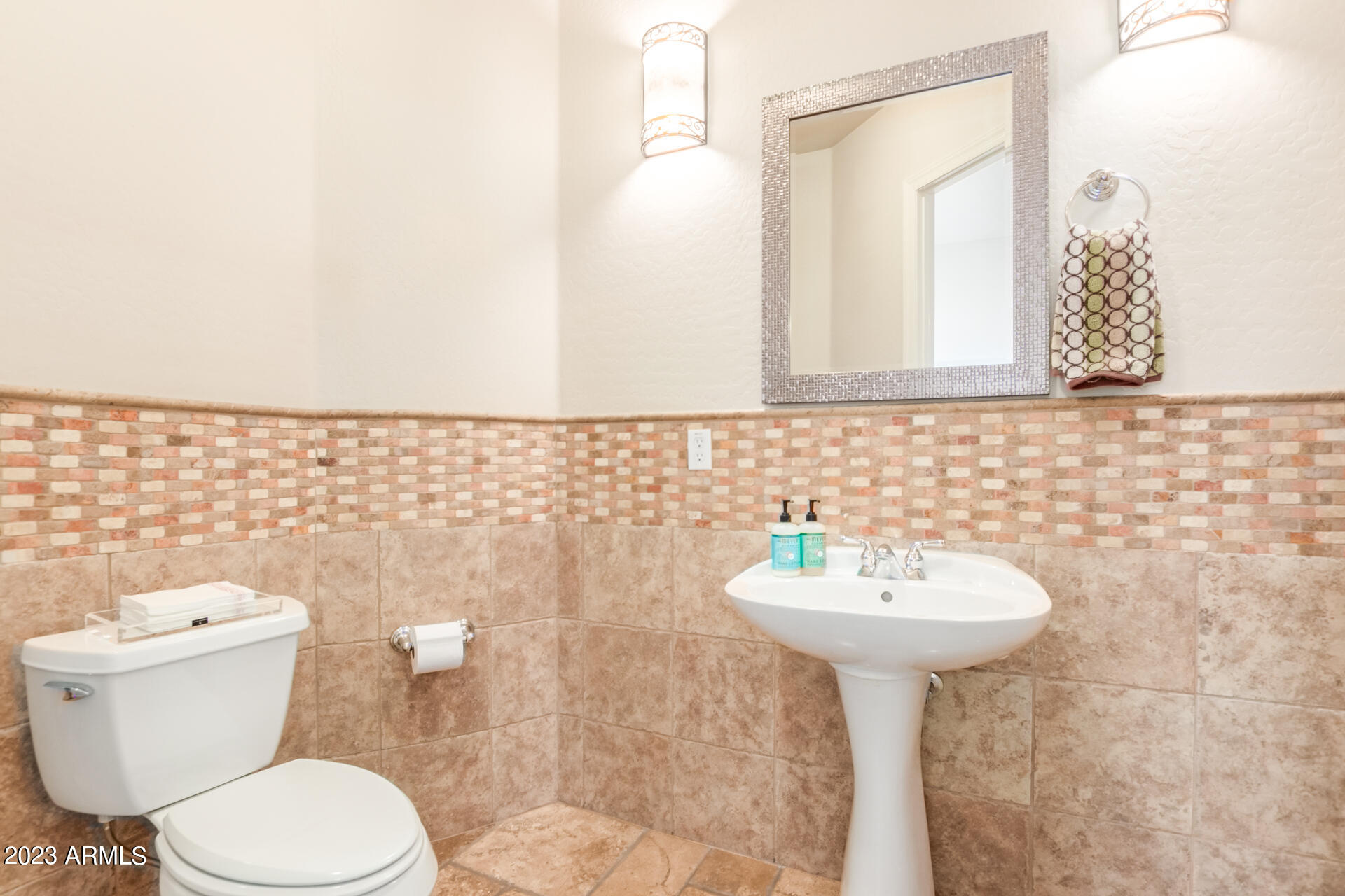 14234 North 27th Place Phoenix, AZ 85032 - Photo 34 of 66 a bathroom with a sink toilet and mirror