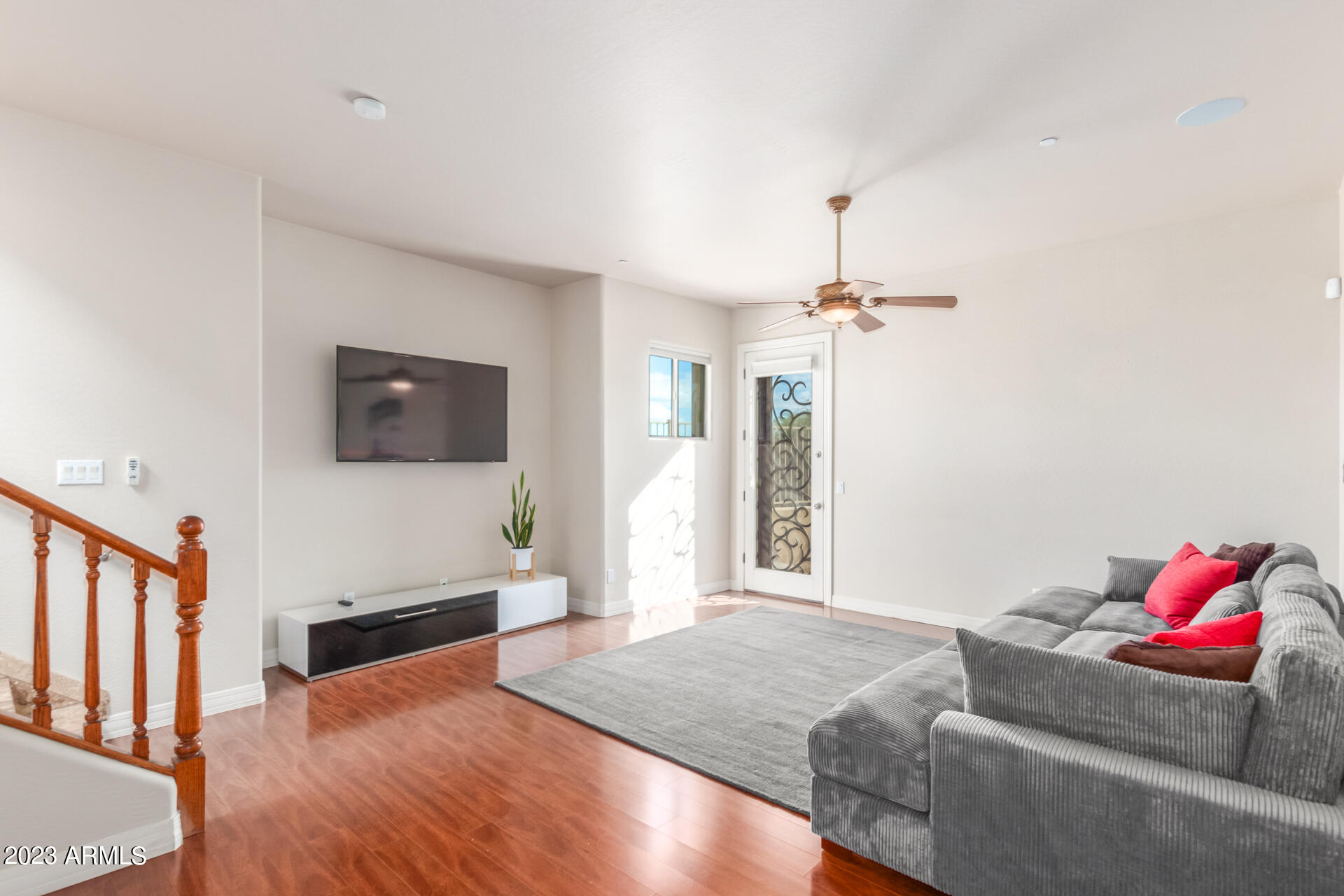 14234 North 27th Place Phoenix, AZ 85032 - Photo 37 of 66 a living room with furniture and a wooden floor