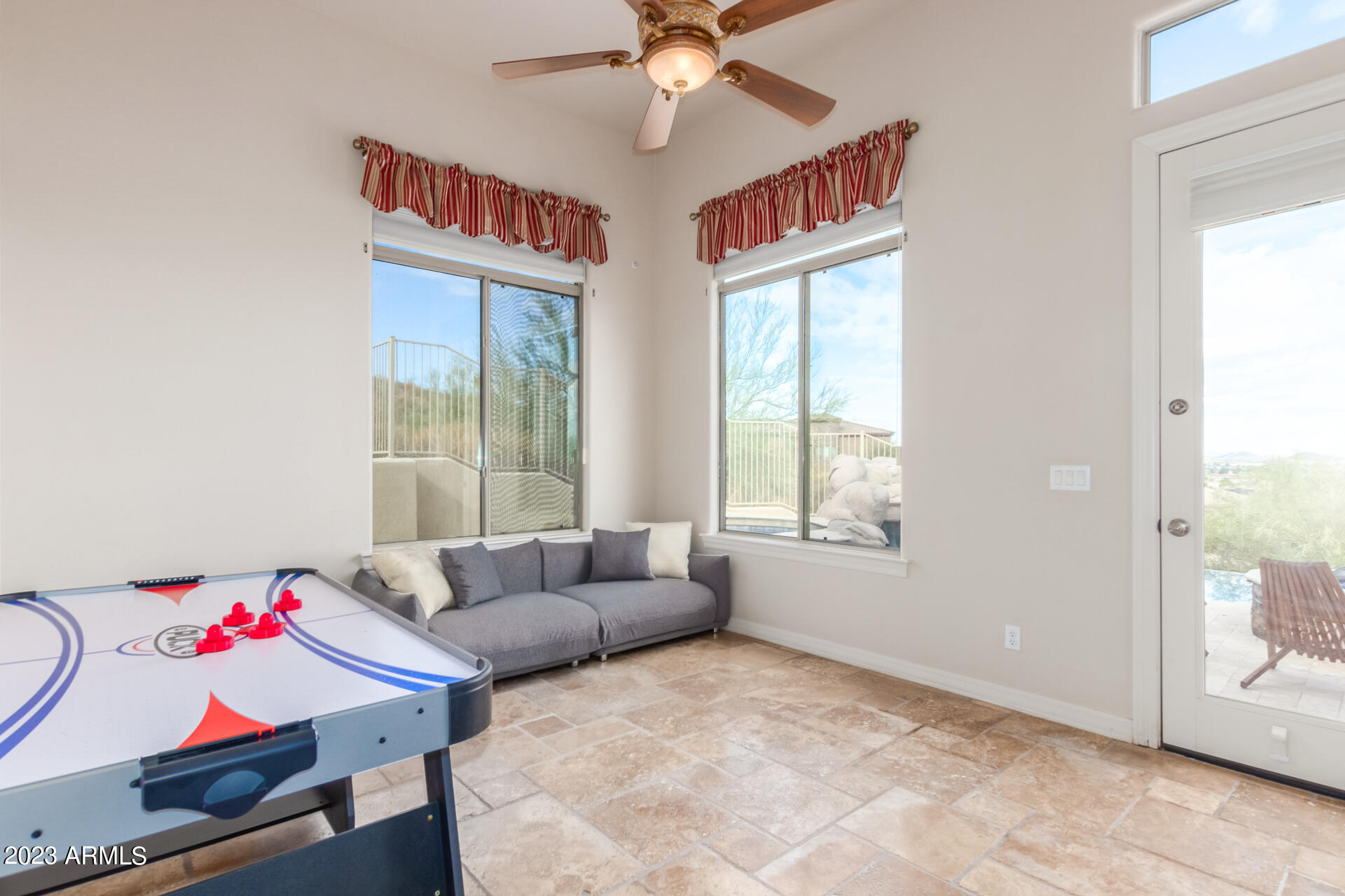 14234 North 27th Place Phoenix, AZ 85032 - Photo 40 of 66 a living room with furniture and a window