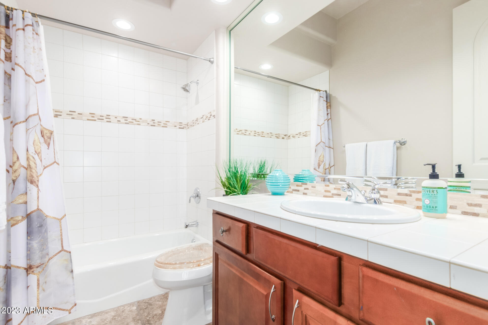 14234 North 27th Place Phoenix, AZ 85032 - Photo 48 of 66 a bathroom with a sink a toilet and shower
