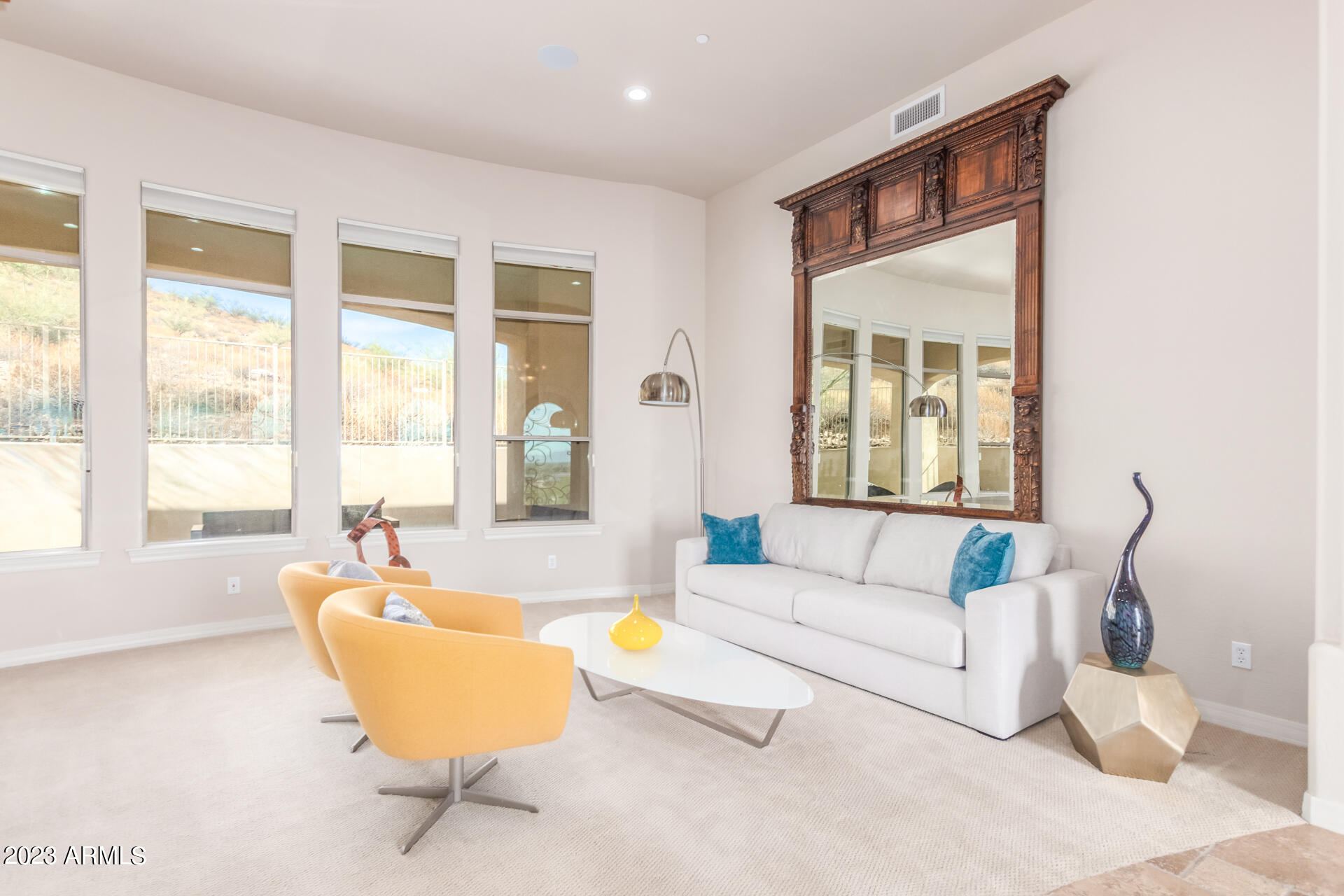 14234 North 27th Place Phoenix, AZ 85032 - Photo 5 of 66 a living room with furniture and a large window