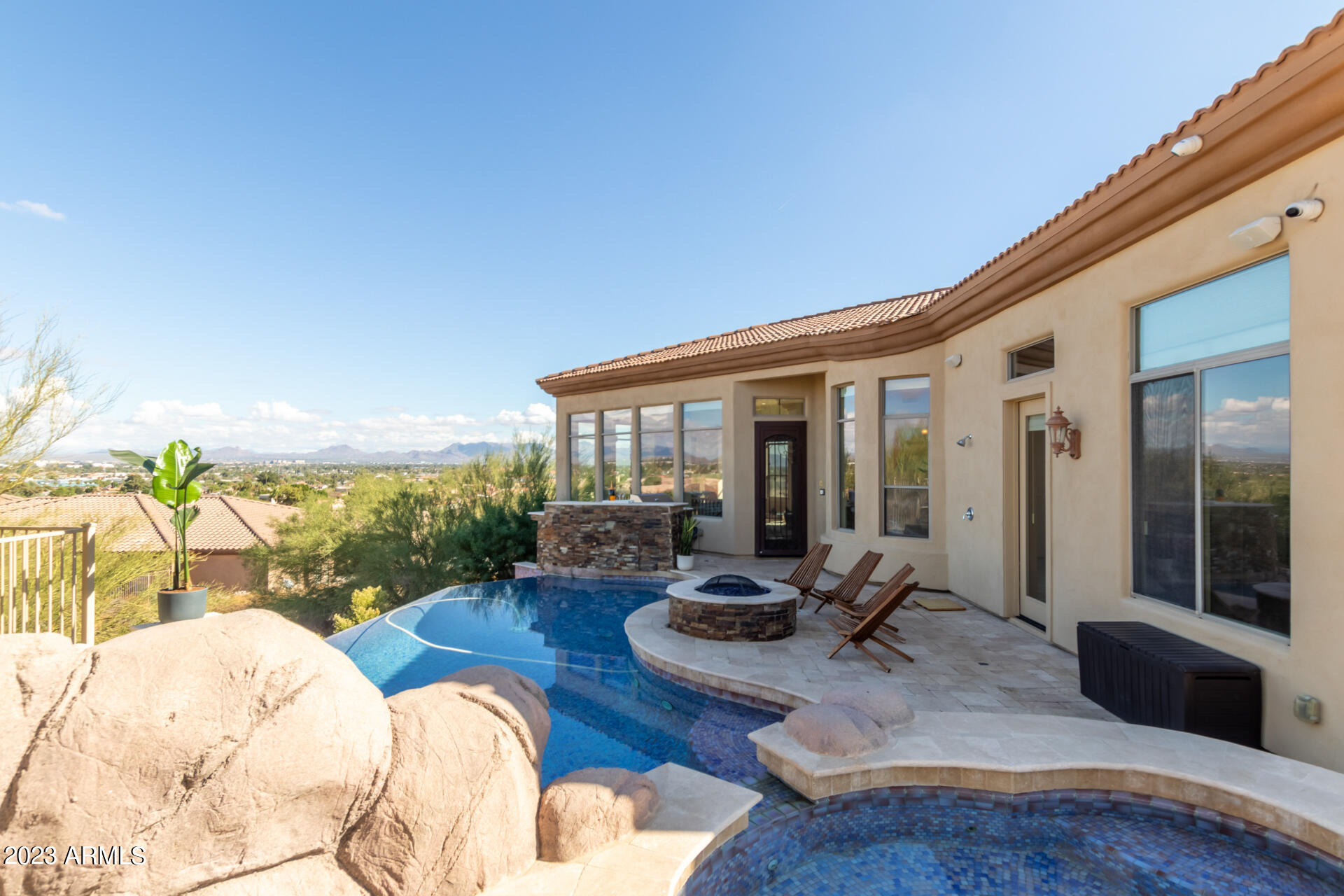 14234 North 27th Place Phoenix, AZ 85032 - Photo 65 of 66 a view of a swimming pool with furniture