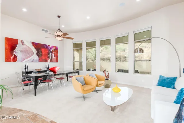 a dining room with furniture and window