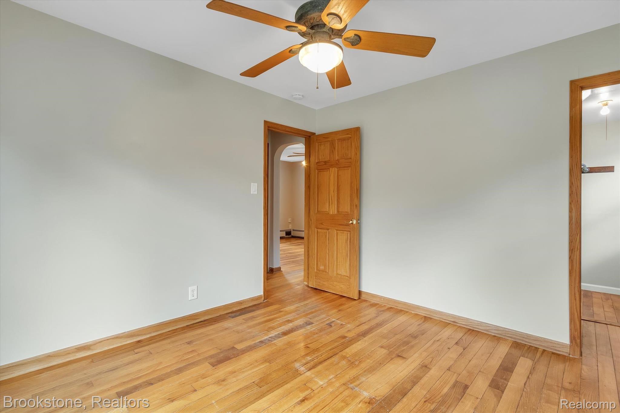 21038 Gill Road Farmington, MI 48335 - Photo 13 of 25 Walk in closet and hardwood flooring in master.