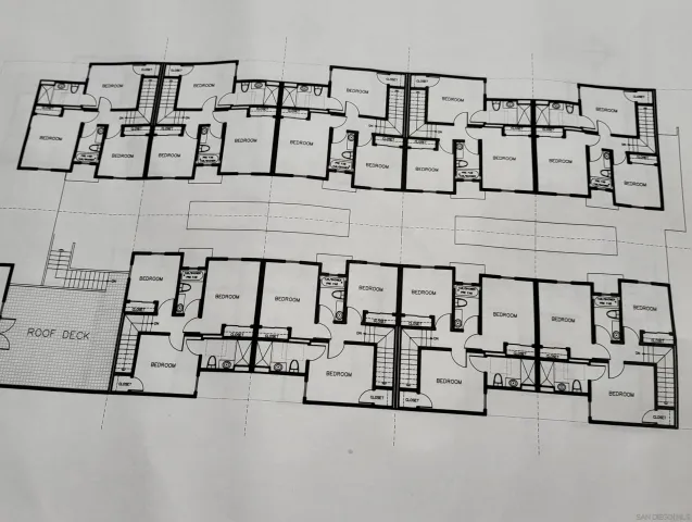 a bathroom with a tub shower and sink