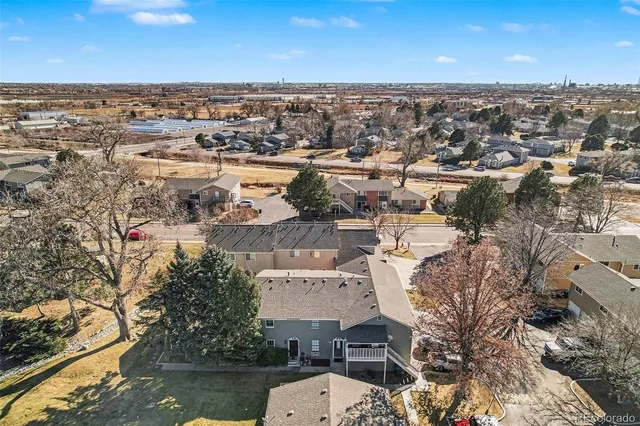an aerial view of a house with a lake view