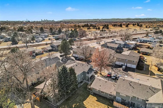 an aerial view of a building with parking