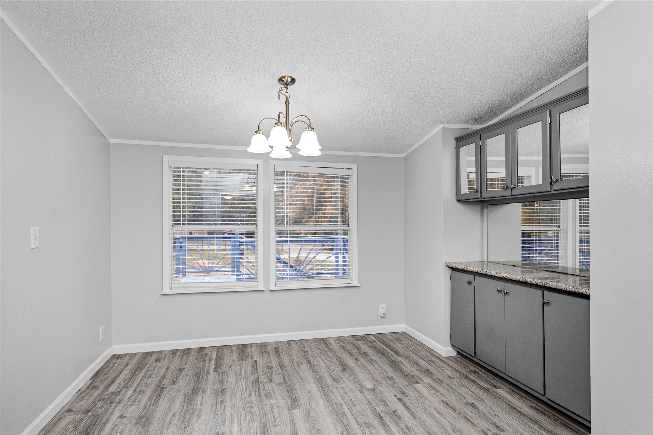 4621 Price Road Montgomery, TX 77316 - Photo 16 of 50 a view of an empty room with a window and wooden floor