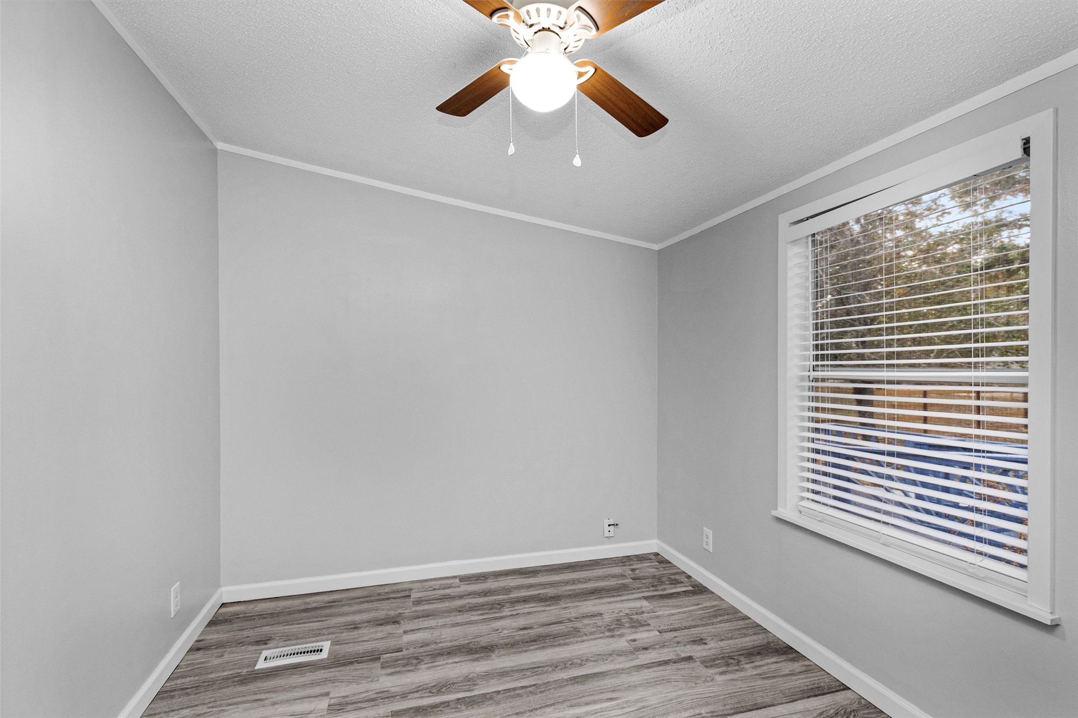 4621 Price Road Montgomery, TX 77316 - Photo 18 of 50 wooden floor in an empty room with a window