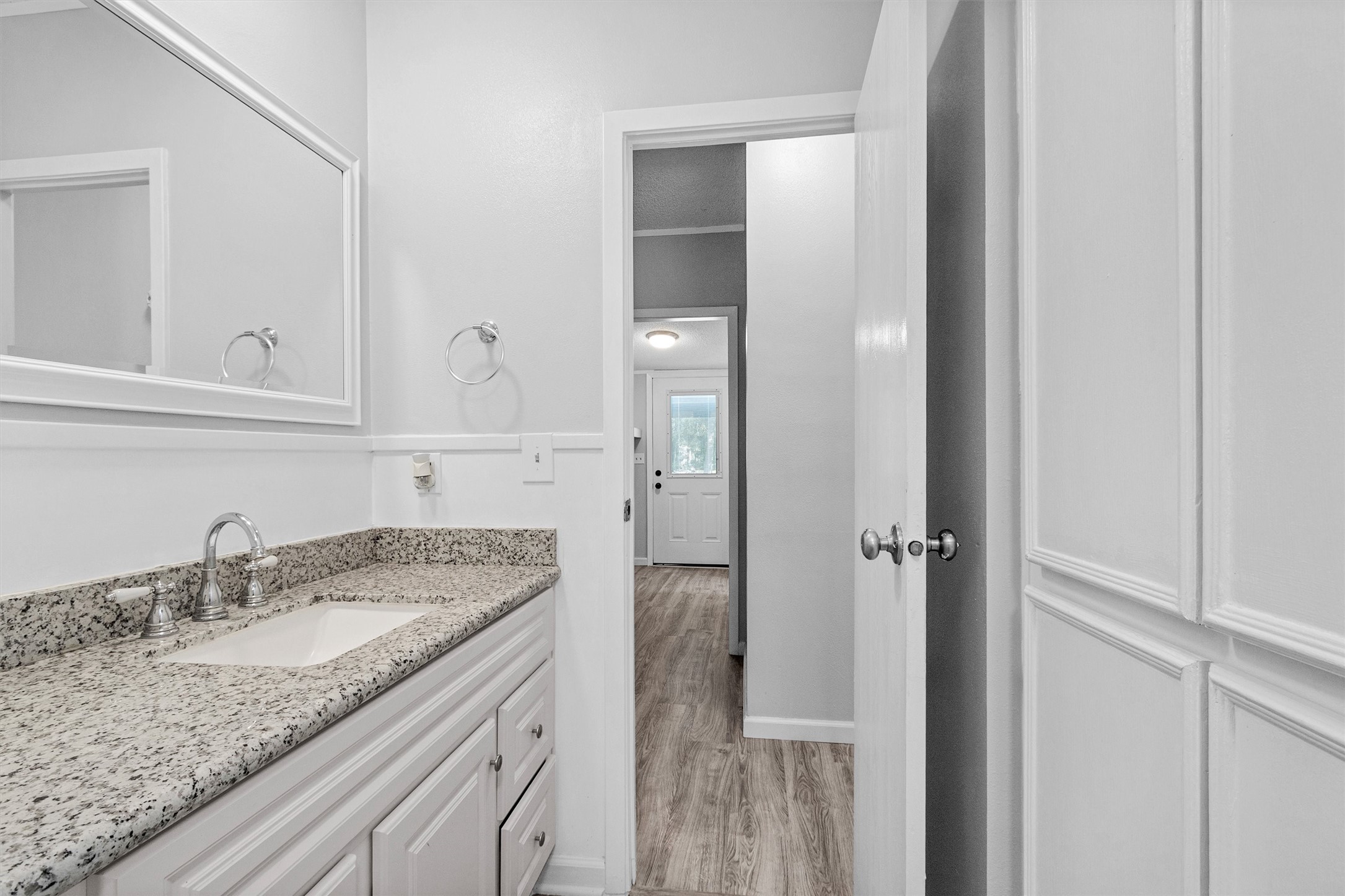 4621 Price Road Montgomery, TX 77316 - Photo 23 of 50 a bathroom with a granite countertop sink and a mirror