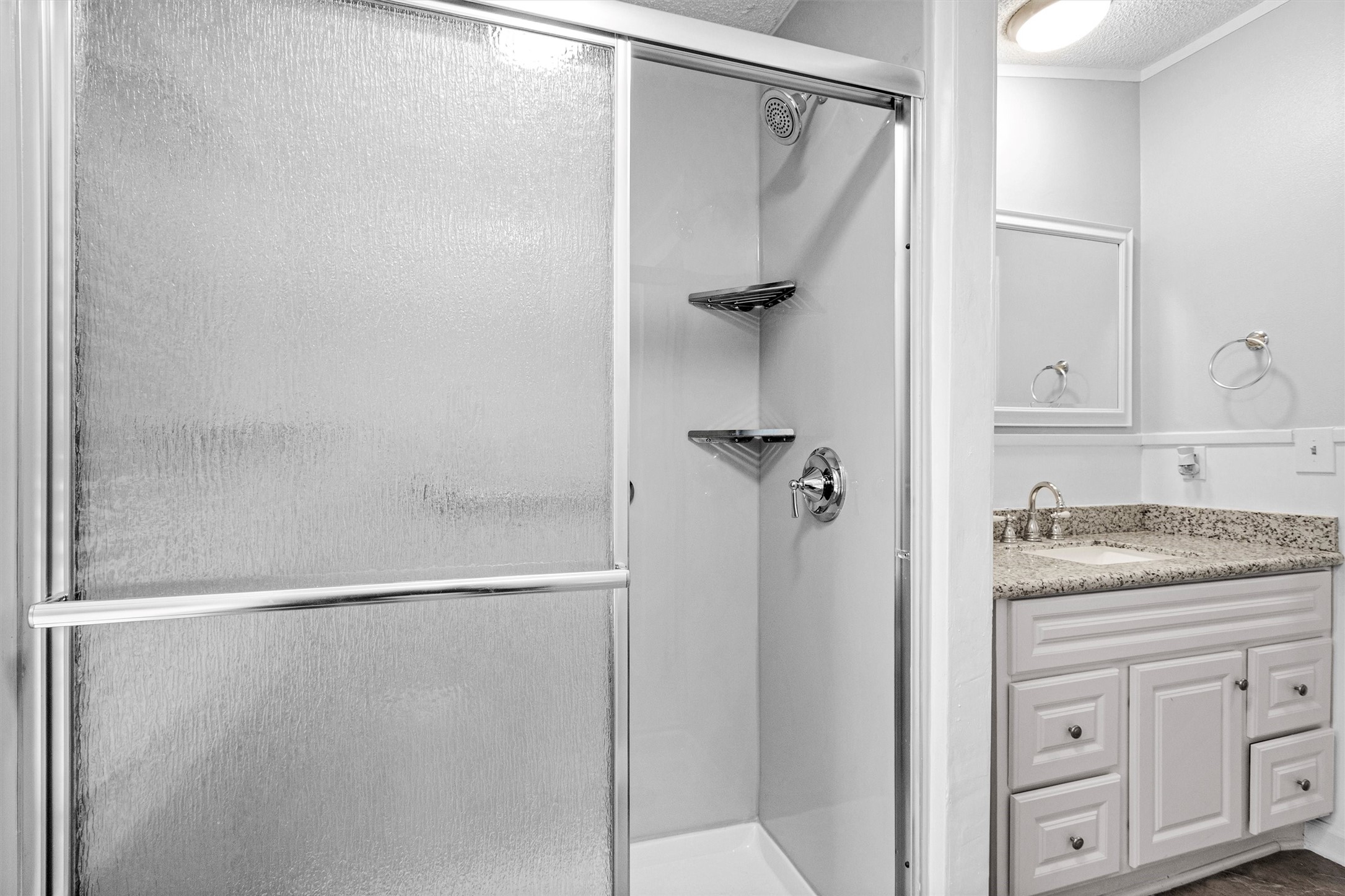 4621 Price Road Montgomery, TX 77316 - Photo 24 of 50 a bathroom with a granite countertop shower and a sink