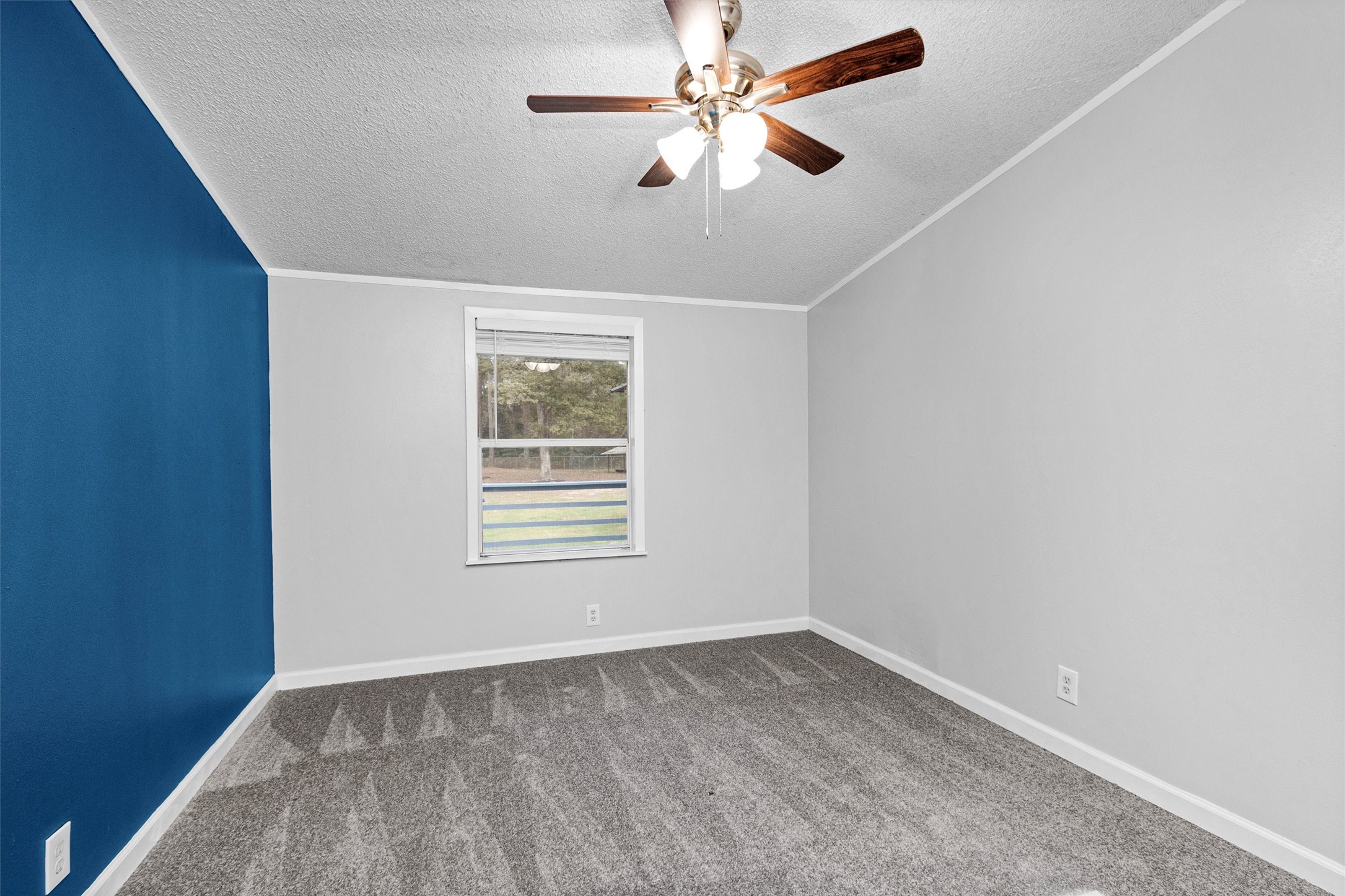 4621 Price Road Montgomery, TX 77316 - Photo 25 of 50 an empty room with a window and a fan