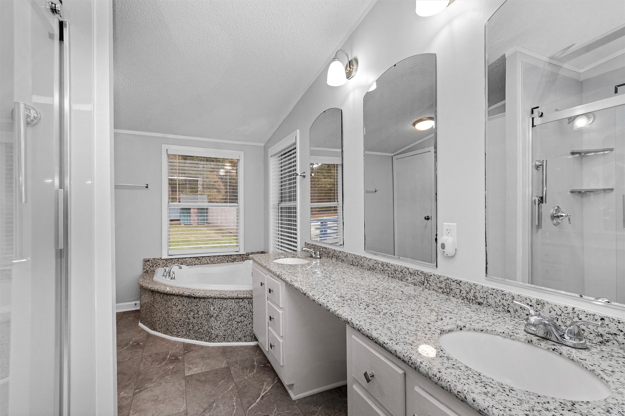 4621 Price Road Montgomery, TX 77316 - Photo 30 of 50 a bathroom with a granite countertop double vanity sink and a mirror