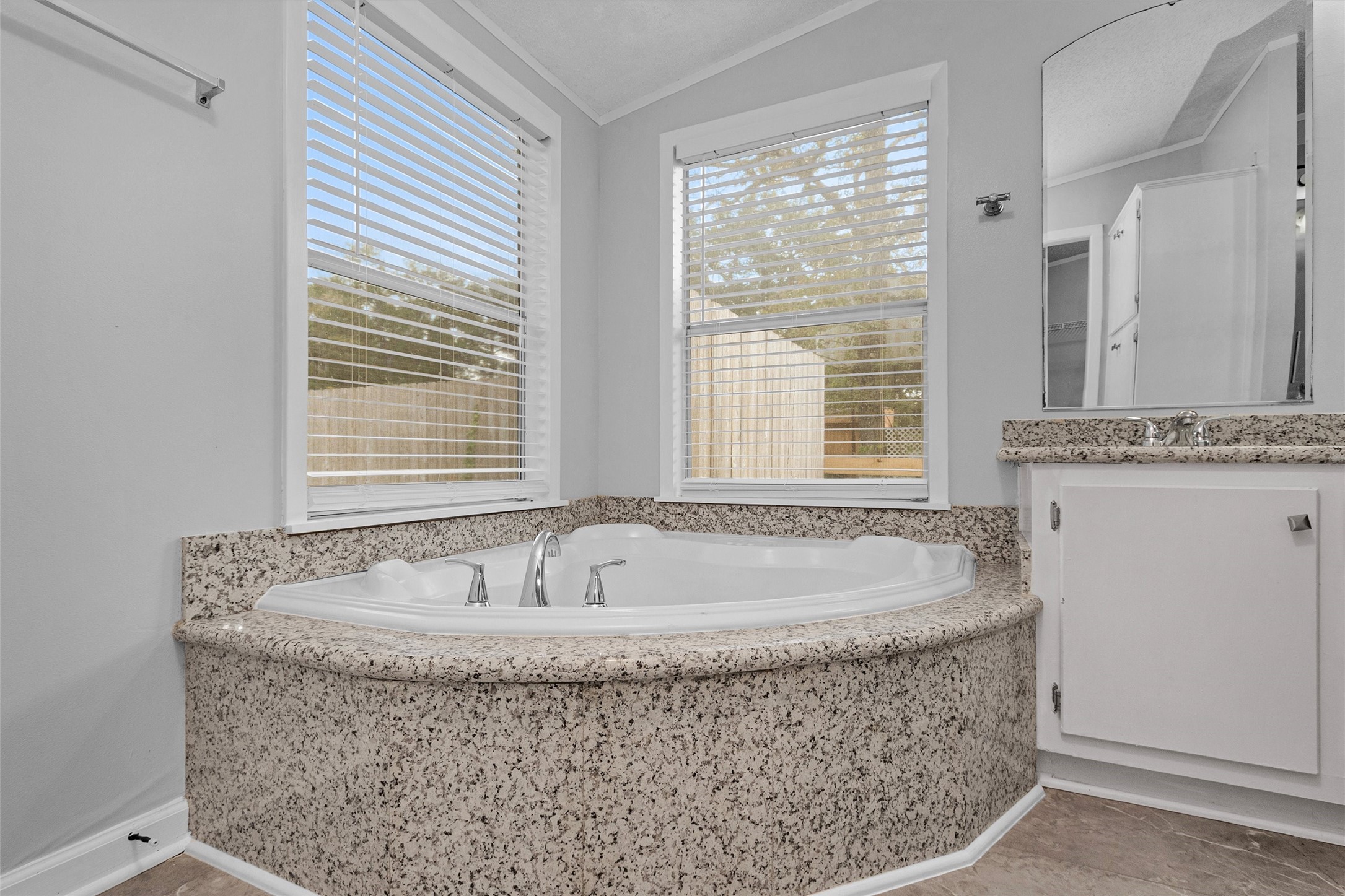 4621 Price Road Montgomery, TX 77316 - Photo 31 of 50 a bath tub sitting in a bathroom next to a window