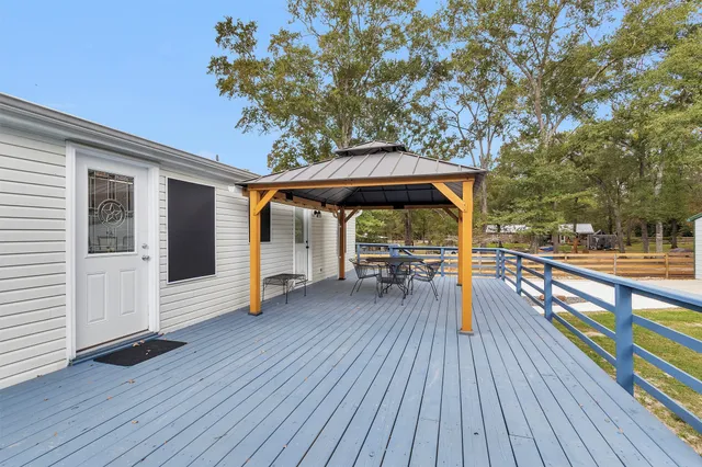 a view of outdoor seating space with wooden floor