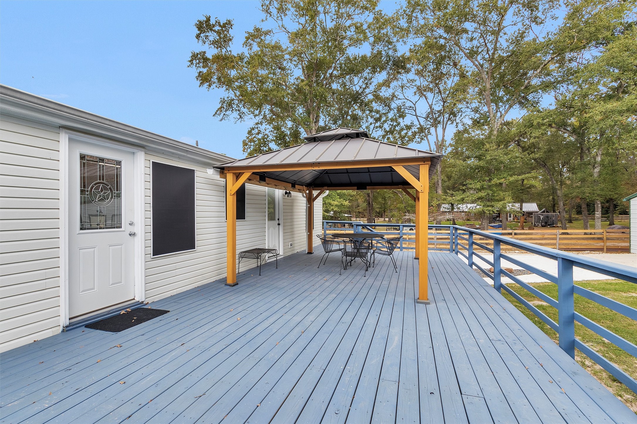 4621 Price Road Montgomery, TX 77316 - Photo 35 of 50 a view of outdoor seating space with wooden floor