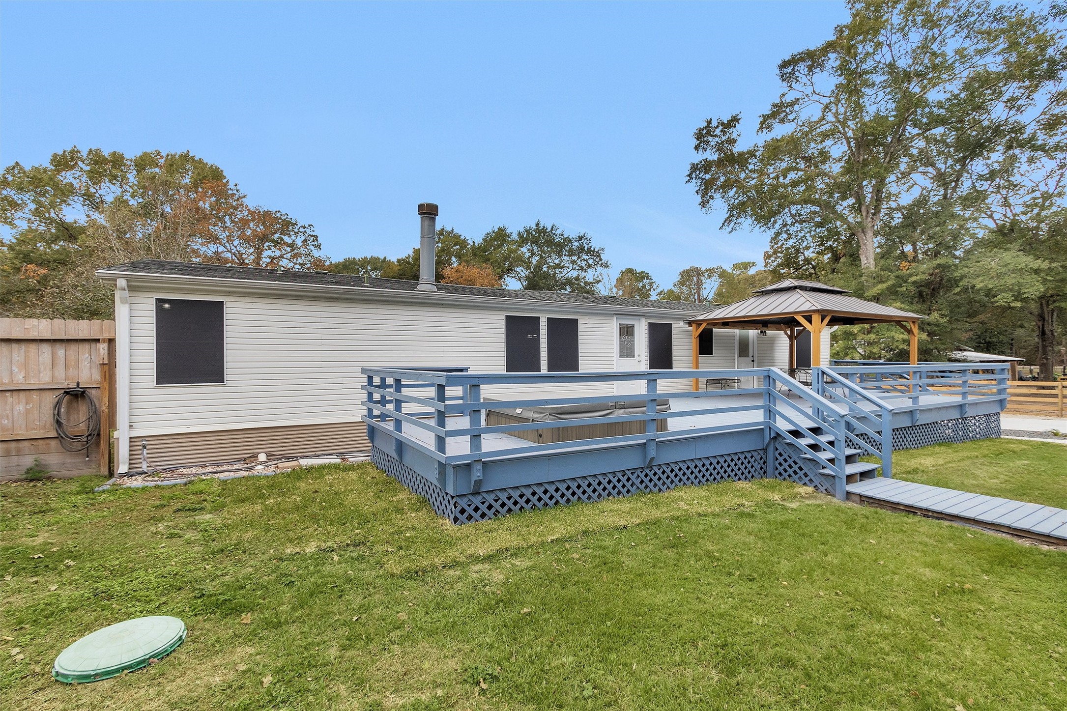 4621 Price Road Montgomery, TX 77316 - Photo 38 of 50 a view of a house with a yard and sitting area