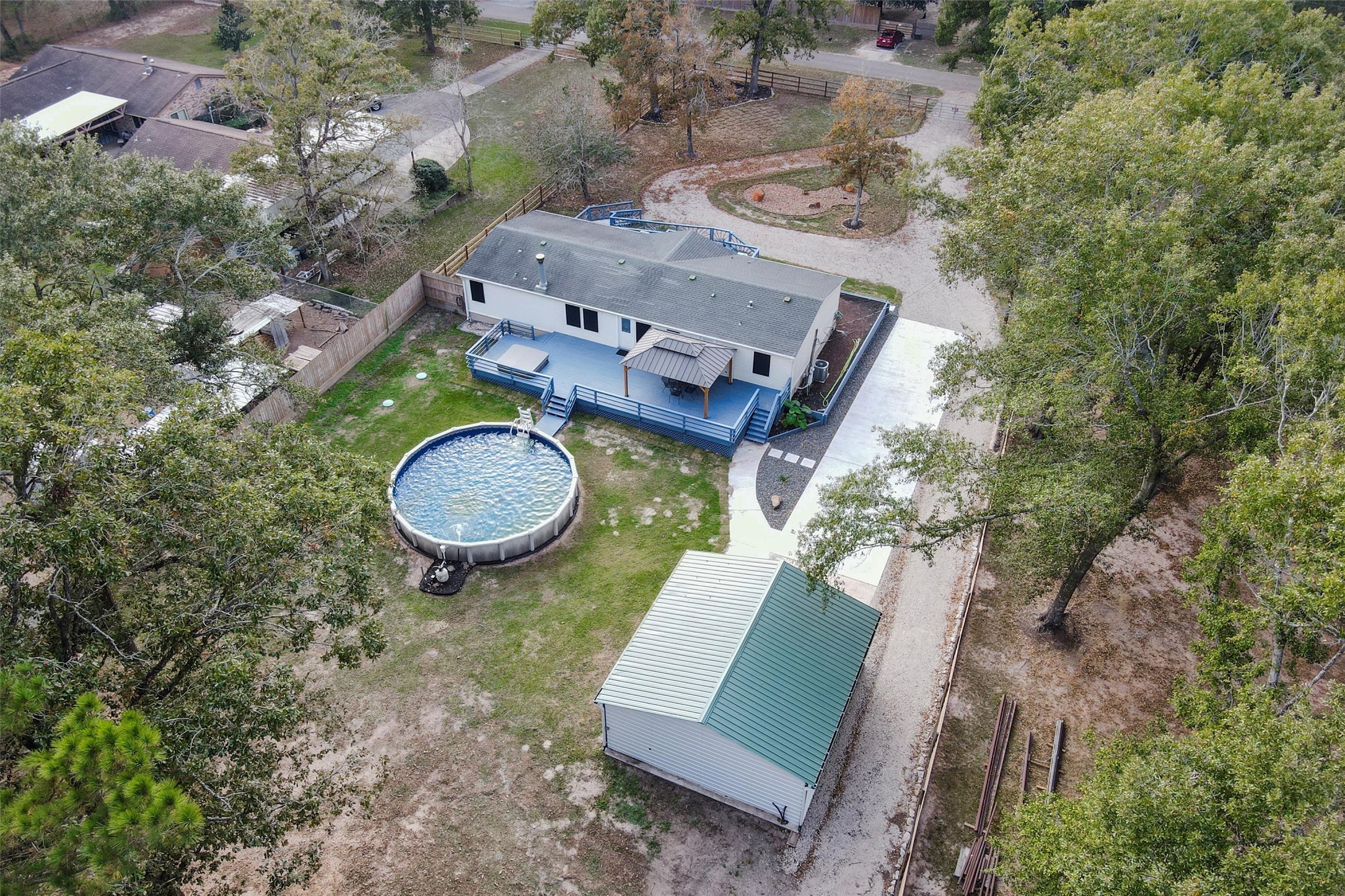 4621 Price Road Montgomery, TX 77316 - Photo 50 of 50 an aerial view of a house with backyard space and trees