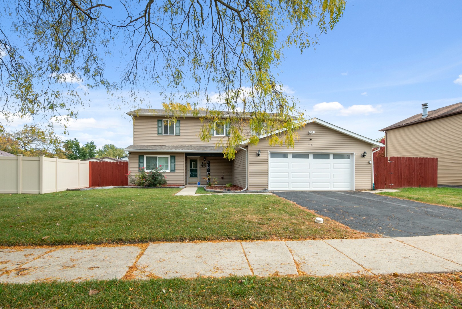 13 Oakview Road Matteson, IL 60443 - Photo 1 of 23 a front view of a house with garden