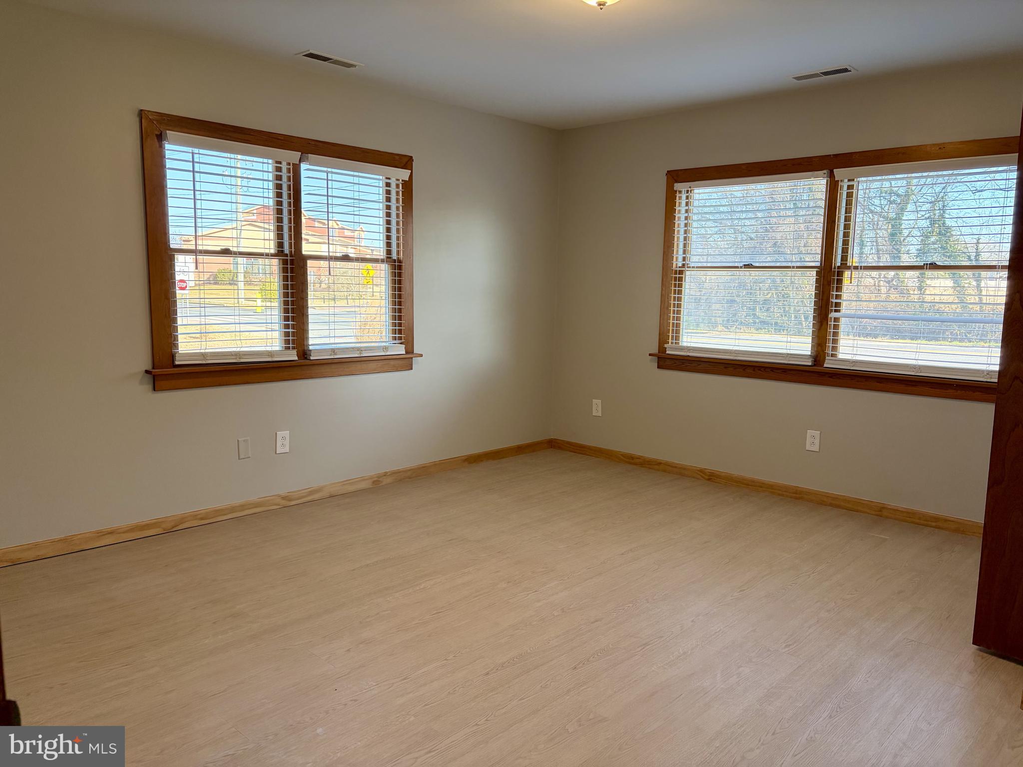 702 Federal Street Milton, DE 19968 - Photo 11 of 23 an empty room with a window