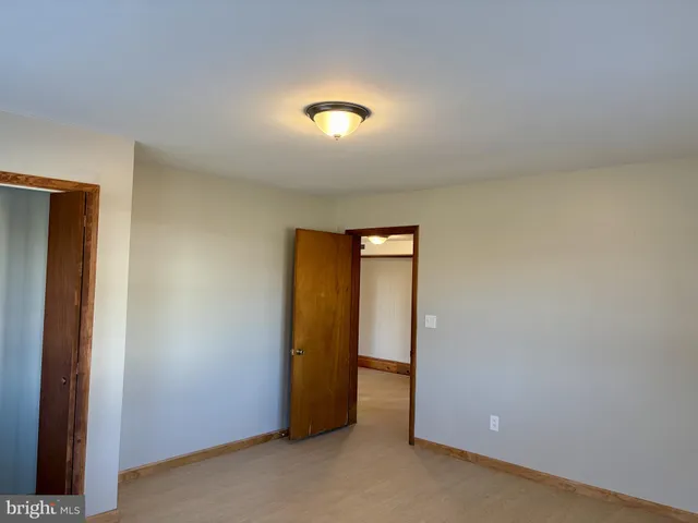 a bathroom with a toilet and a bath tub