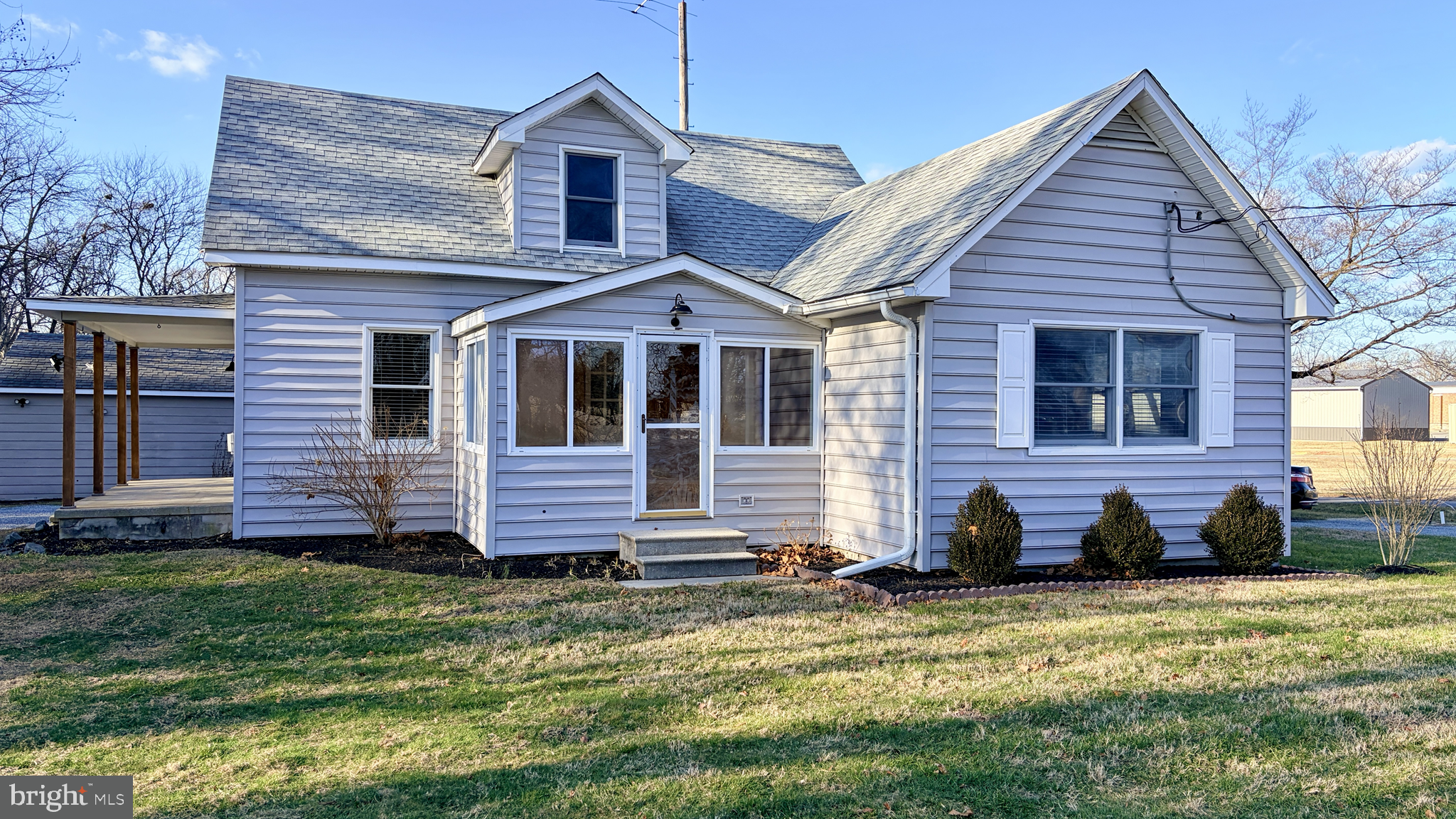 702 Federal Street Milton, DE 19968 - Photo 2 of 23 a front view of a house with a yard